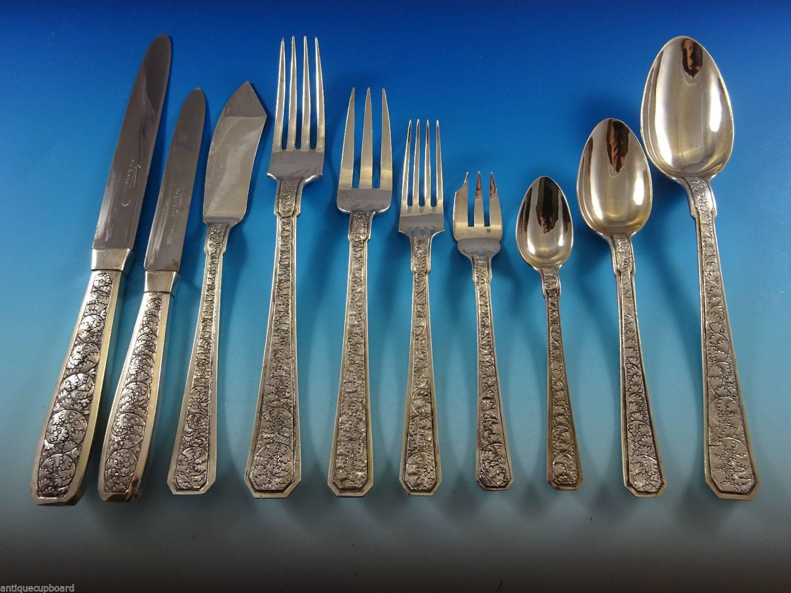 Handmade sterling silver (tested) Chinese or Japanese flatware set with fabulous scrolling engraved detail, circa 1930s. Hand chased and heavy. This 142 piece set includes: 12 dinner knives, 9 1/2