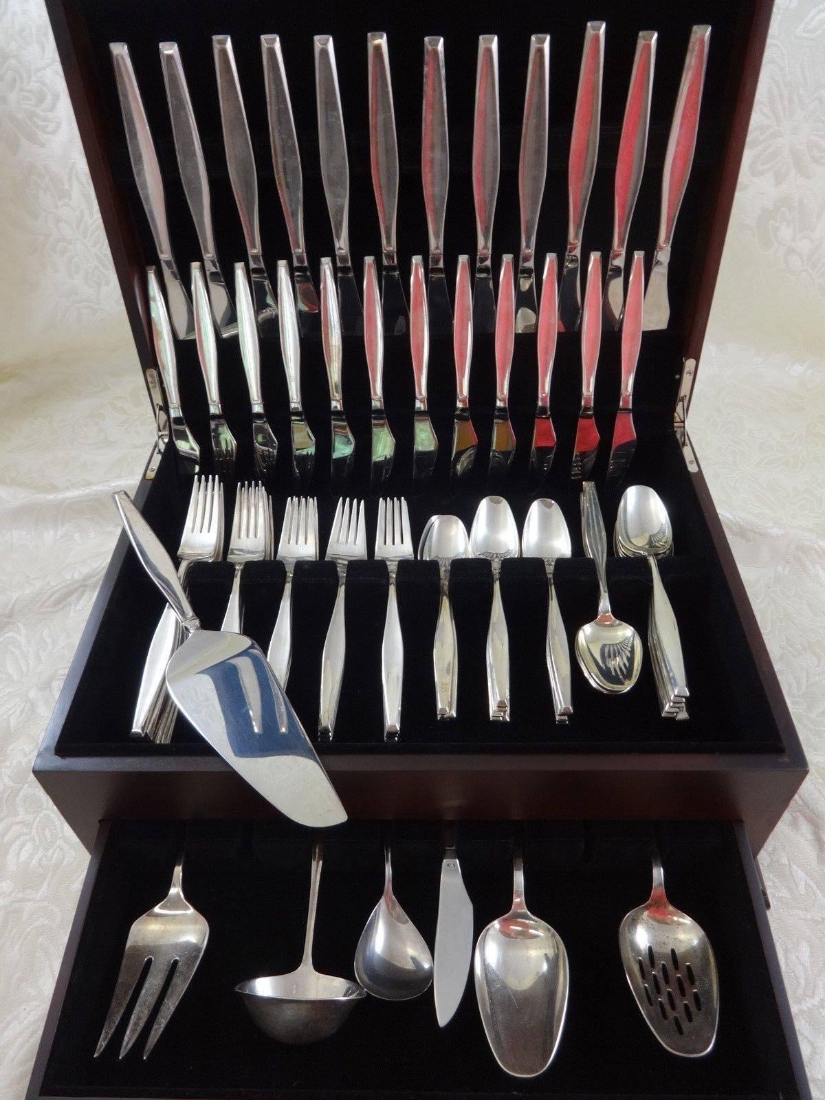 Classique by Gorham sterling silver flatware set, 103 pieces. This pattern was designed by Burr Sebring. Sebring studied metalsmithing with famed designers John Prip and Hans Christensen at the School for American Craftsmen. This set includes: 

12