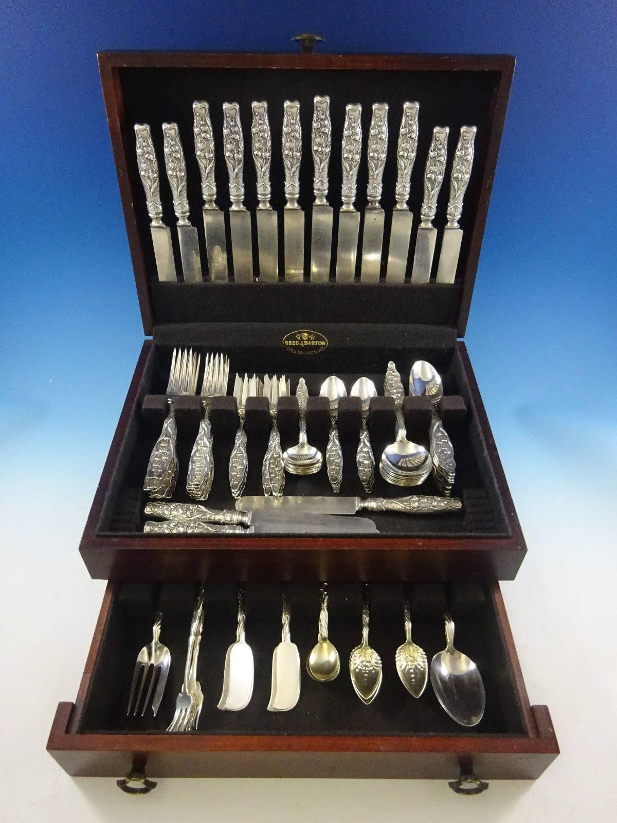 Lily of the Valley by Whiting circa 1885 sterling silver flatware set of 107 pieces. This set includes: 

Eight dinner size knives, blunt silver plated blades, 9 3/8