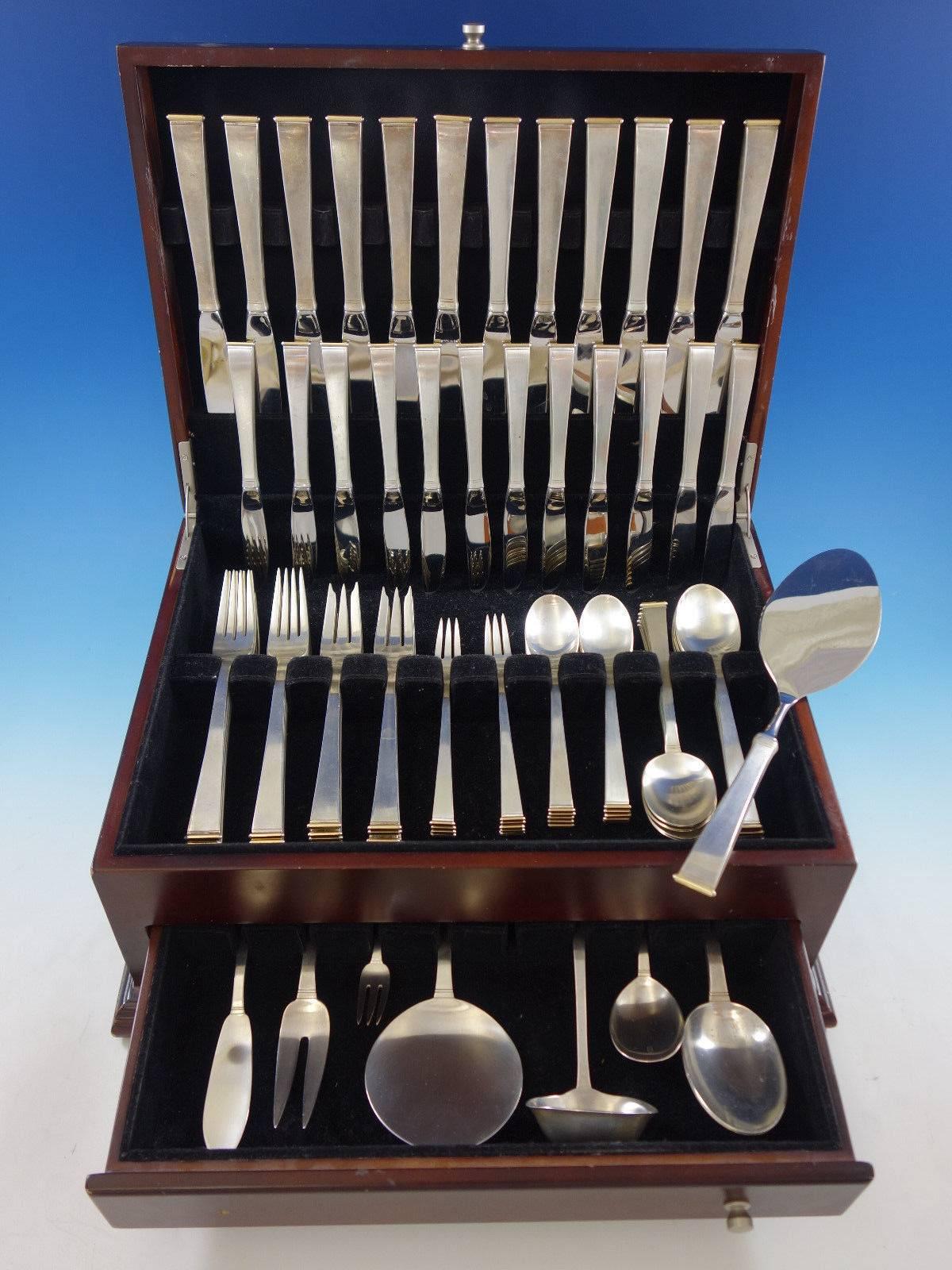 Gold Tip by Gorham sterling silver and 18-karat gold flatware set with matte finish, 92 Pieces. This set includes: 

12 knives, 9 3/8