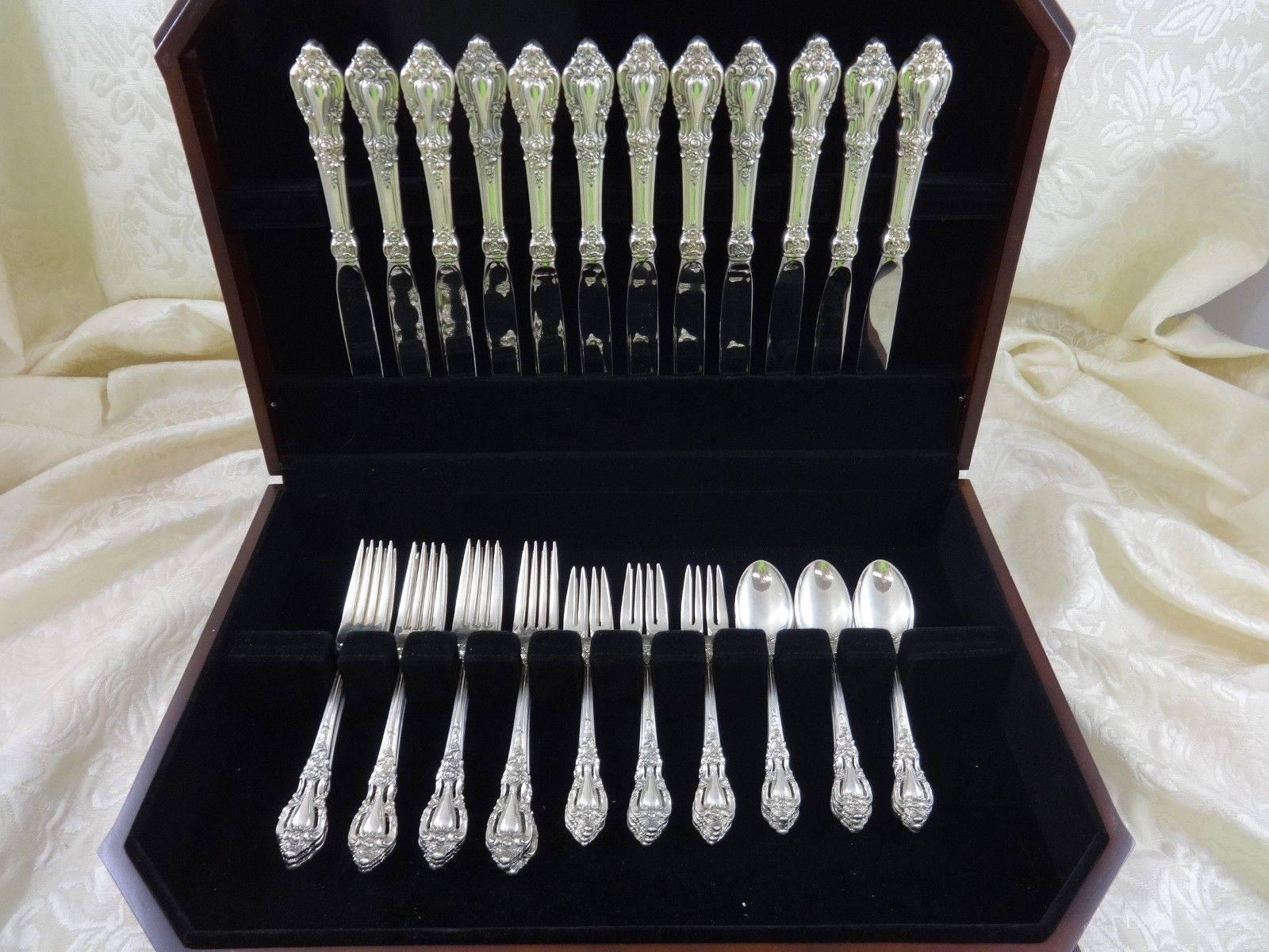 Eloquence by Lunt sterling silver flatware set - - 48 piece true dinner size set, in excellent condition. This set includes: 

12 dinner size knives, 9 3/4
