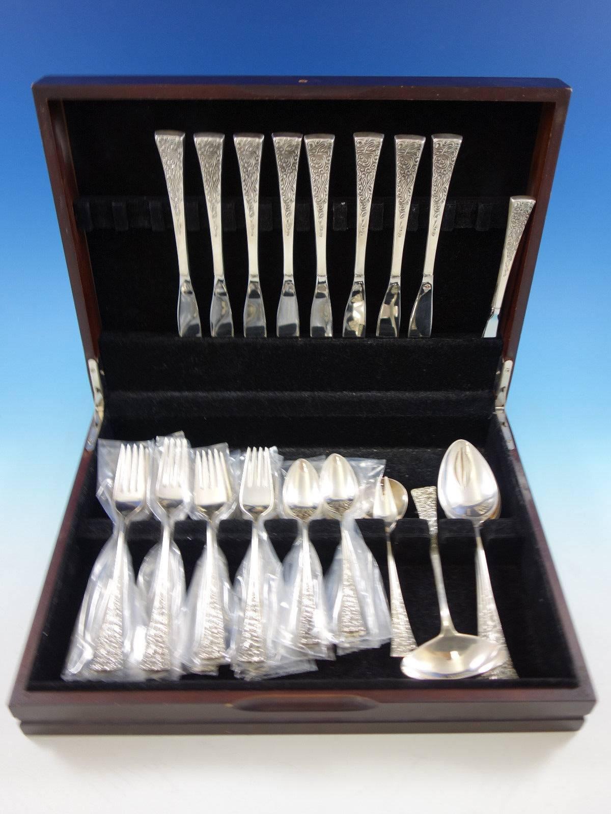 Modern tapestry by Reed and Barton designed by John Prip sterling silver flatware set, 39 pieces. This set includes: 

Eight knives, 9