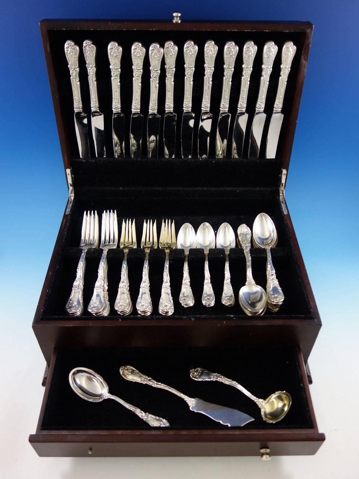 Dinner size Hanover by Gorham sterling silver flatware set, 56 pieces. This scarce pattern with shell motif was introduced by Gorham in the year 1895. This set includes: 12 dinner size knives, 9 3/4", 12 dinner size forks, 7 5/8", 12 salad