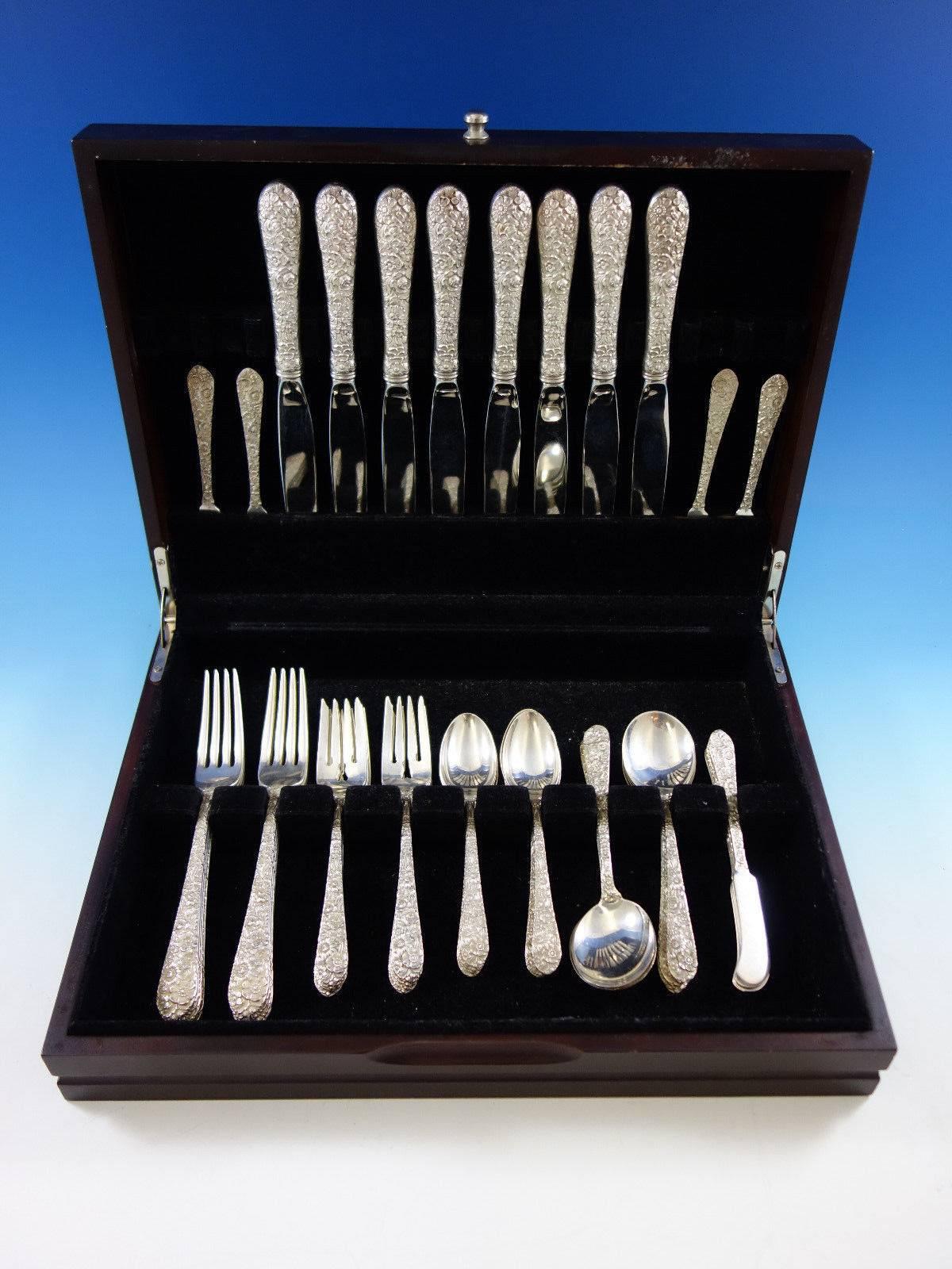 Dinner size bridal bouquet by Alvin repousse sterling silver flatware set, 48 pieces. This set includes: 

eight dinner size knives, 9 5/8