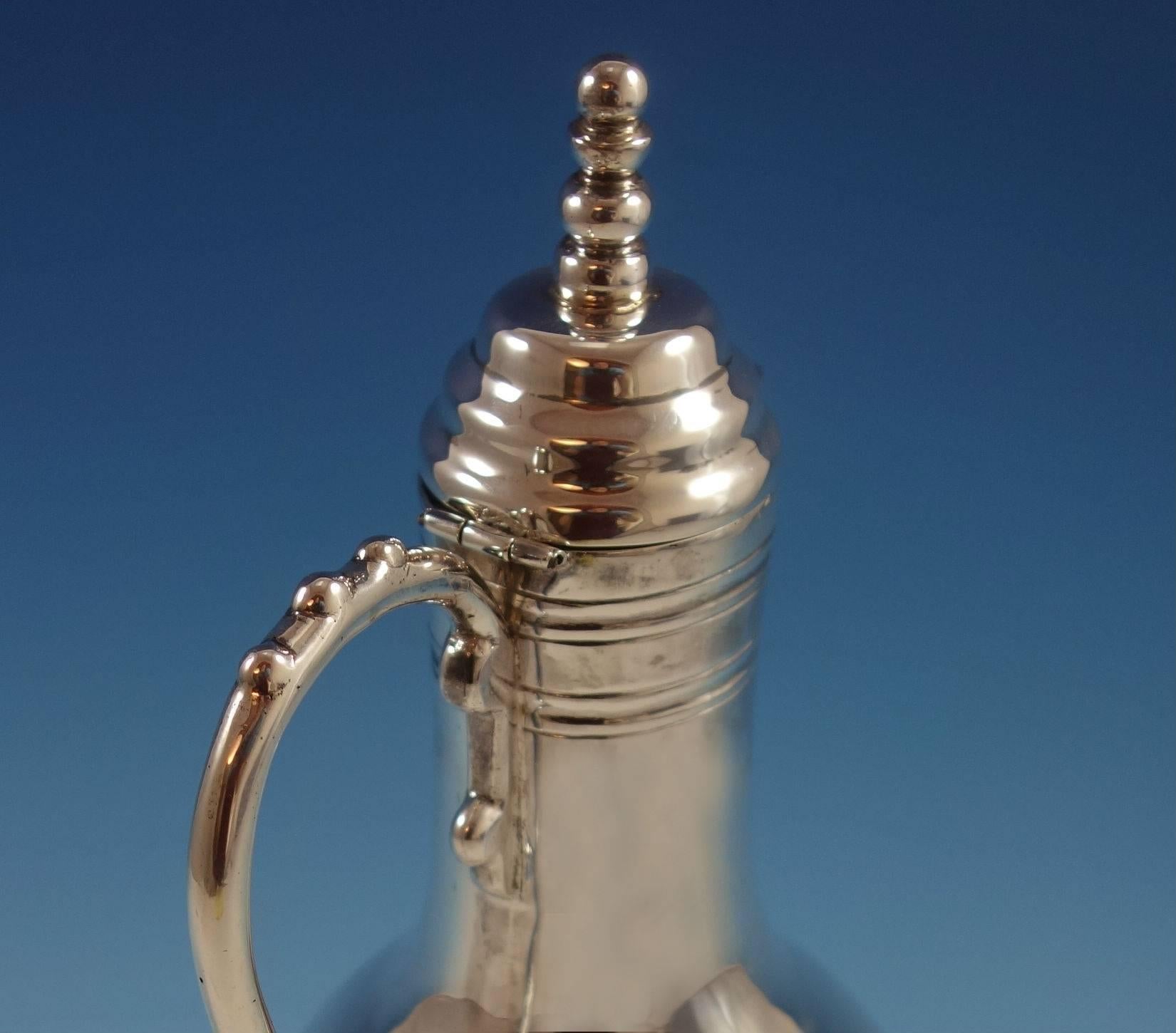 Beautiful sterling silver wine ewer made by Sanborns in Mexico. It has an applied handle, cover and bead finial. It weighs 28.2 ozt. This piece measures 12 1/2
