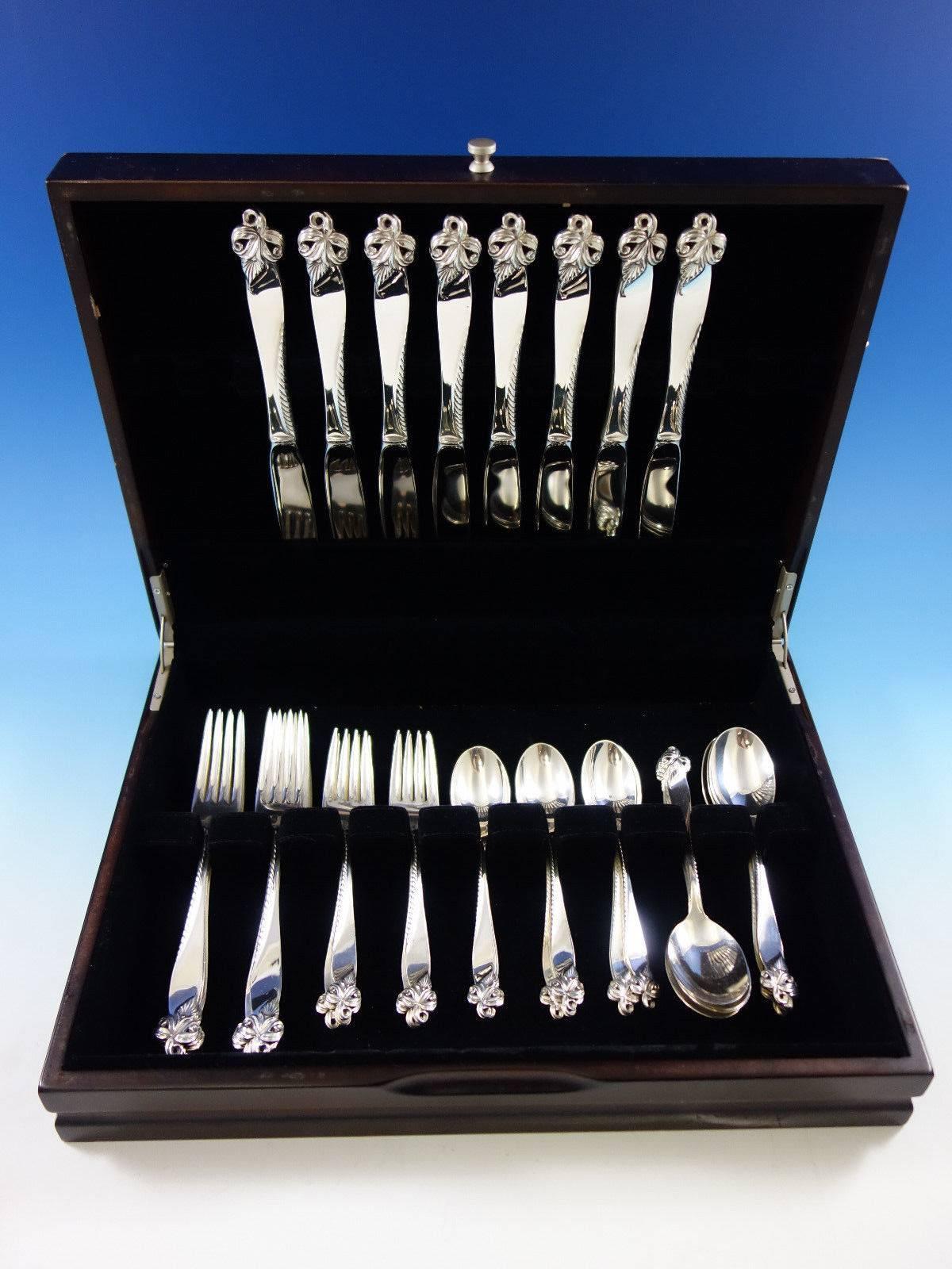 Dinner size Orchid Elegance by Wallace sterling silver flatware set of 40 pieces. This set includes: 

Eight dinner size knives, 9 3/4