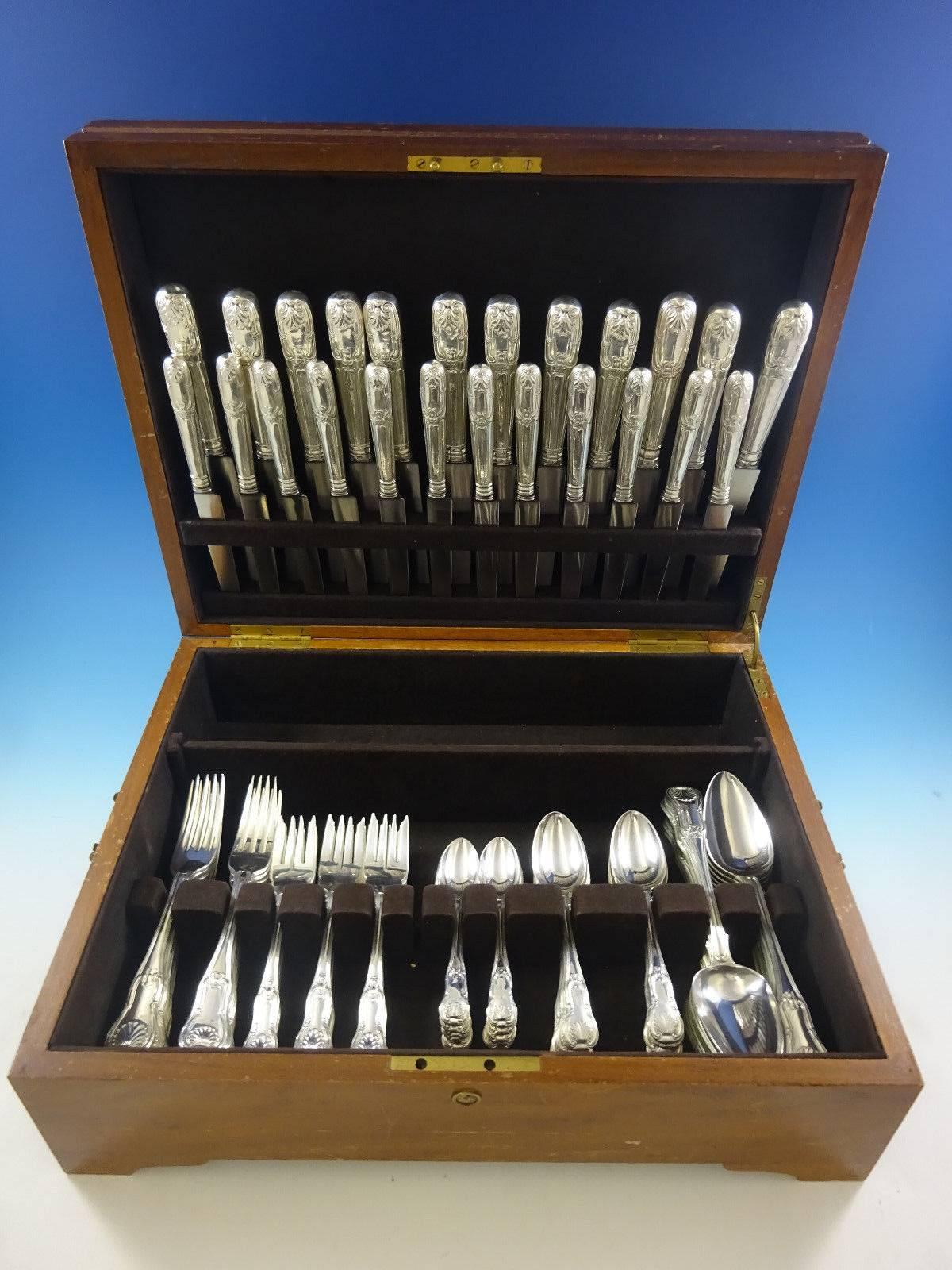 Kings shell motif English sterling silver flatware set, 84 pieces. This set includes: 

12 banquet knives with blunt stainless blades, 10 5/8