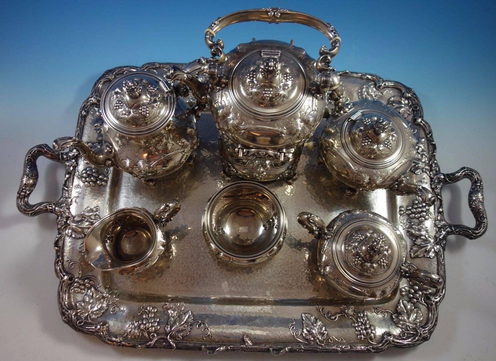 Superb Modernic by Gorham circa 1905 sterling silver six-piece tea set with tray. Incredible set with grapevine and grape motif, fantastic detail throughout. 
All the pieces except for the tray are marked with #1818B, and the tray is marked with