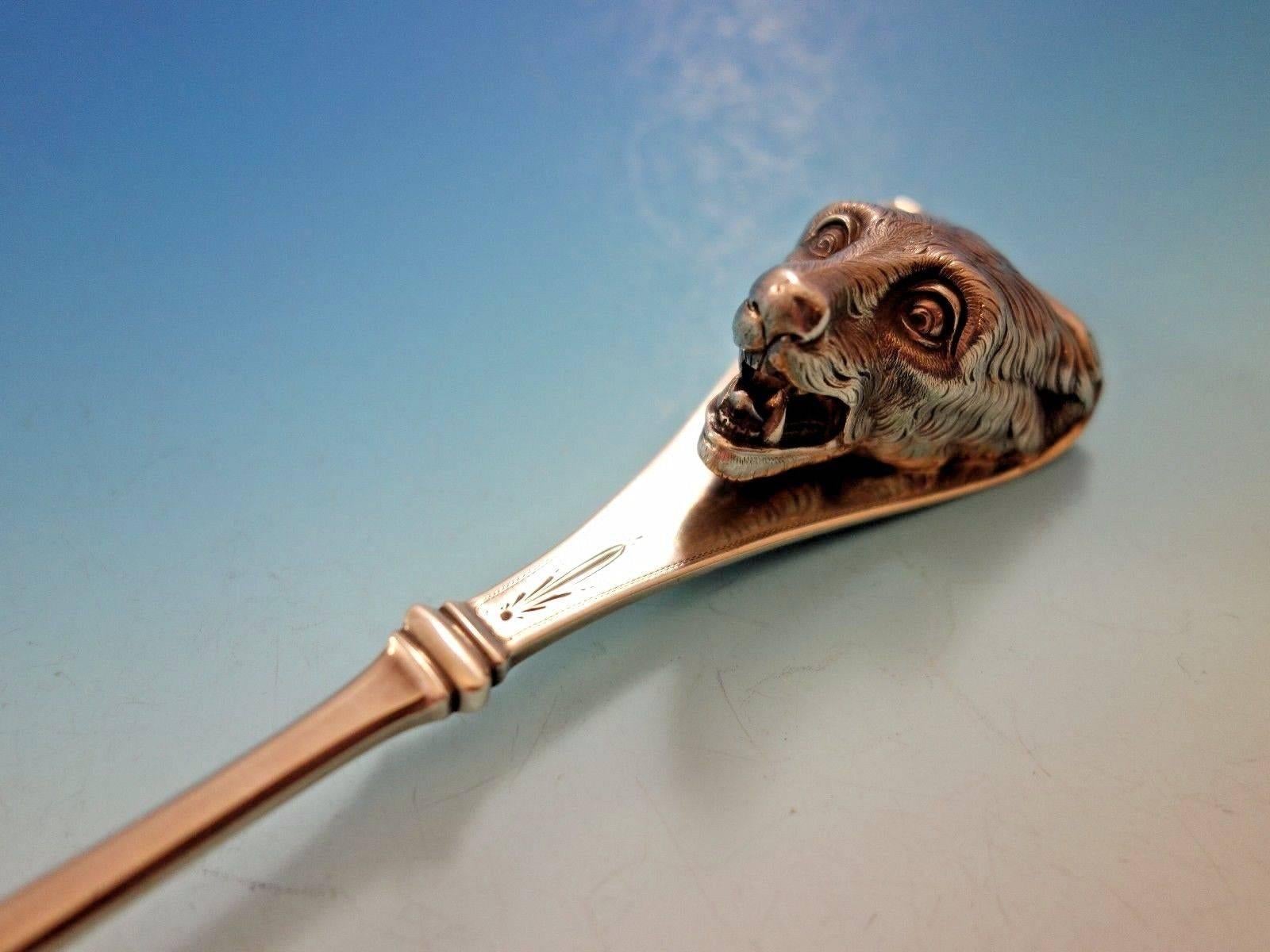 Superb Art silver, circa 1860-1883. Sterling silver art silver ice scoop gold-washed with flowers pierced with flowers and 3D polar bear 11 1/2