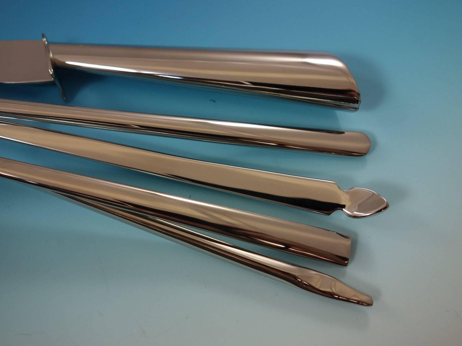 Brand new via Veneto by Ricci ultra modern and unique stainless steel flatware set, 62 pieces. Via Veneto is one of the most unusual patterns we offer - there is truly nothing like it. The long, slender handles and the wavy design are art for your