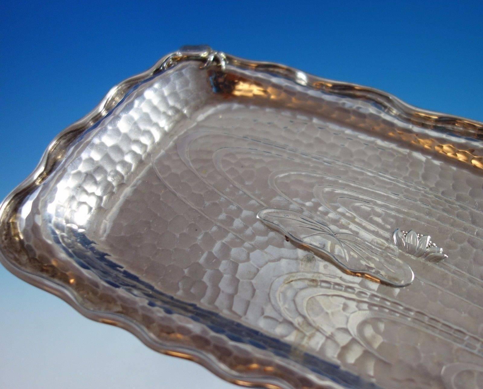 Lap Over Edge by Tiffany & Co. sterling silver tray #1481. The piece is hand hammered and acid etched with rippled water. It has four applied ball feet. It features an applied 3-D crab, applied lily pads, and water lily. Vintage monogram and