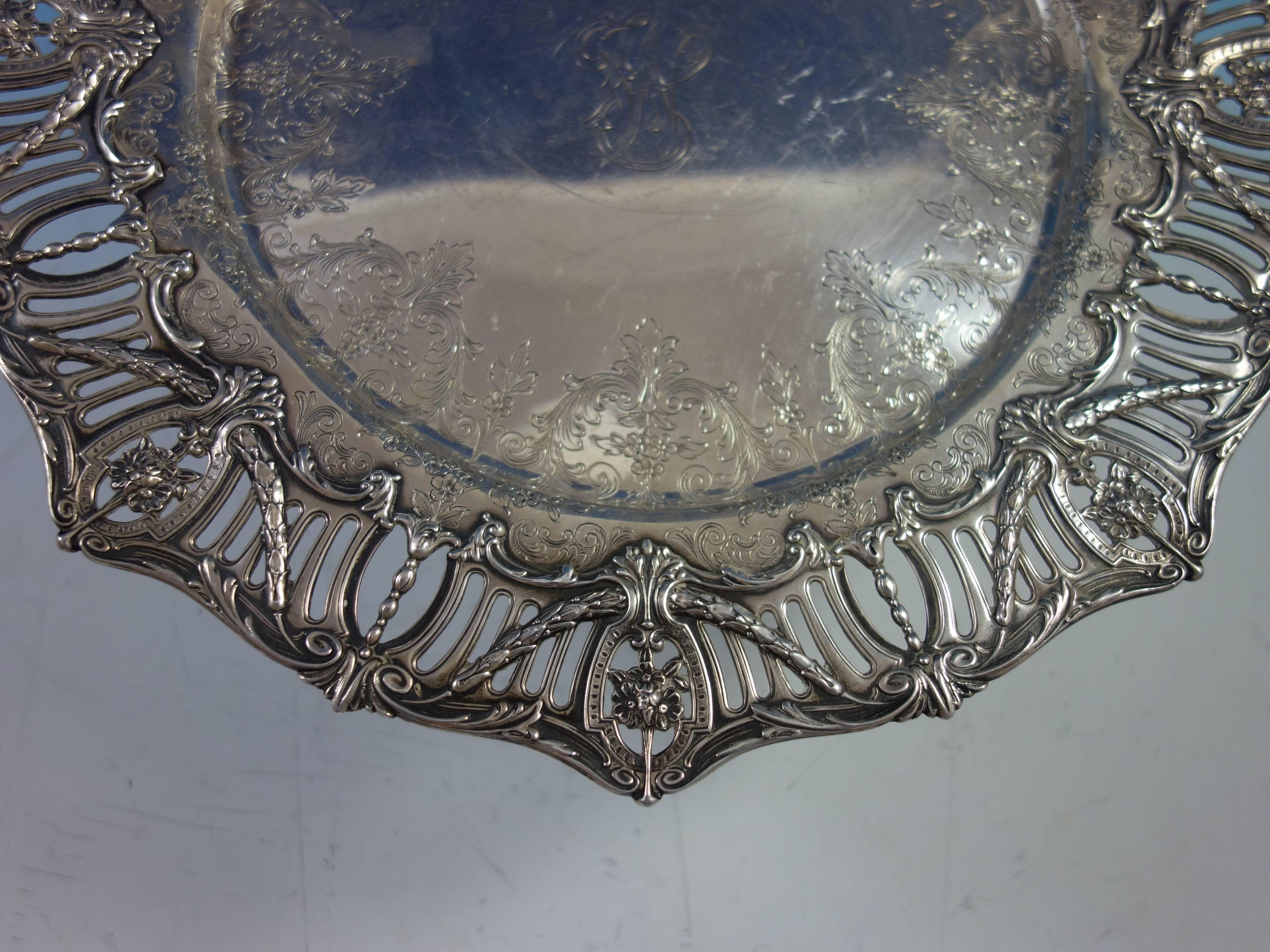 Pierced Border by J.E Caldwell sterling silver sandwich plate/platter. It features a pierced applied cast border with swags and hand chased interior. It has a vintage monogram and an inscription on the reverse with date November 24, 1937 (see