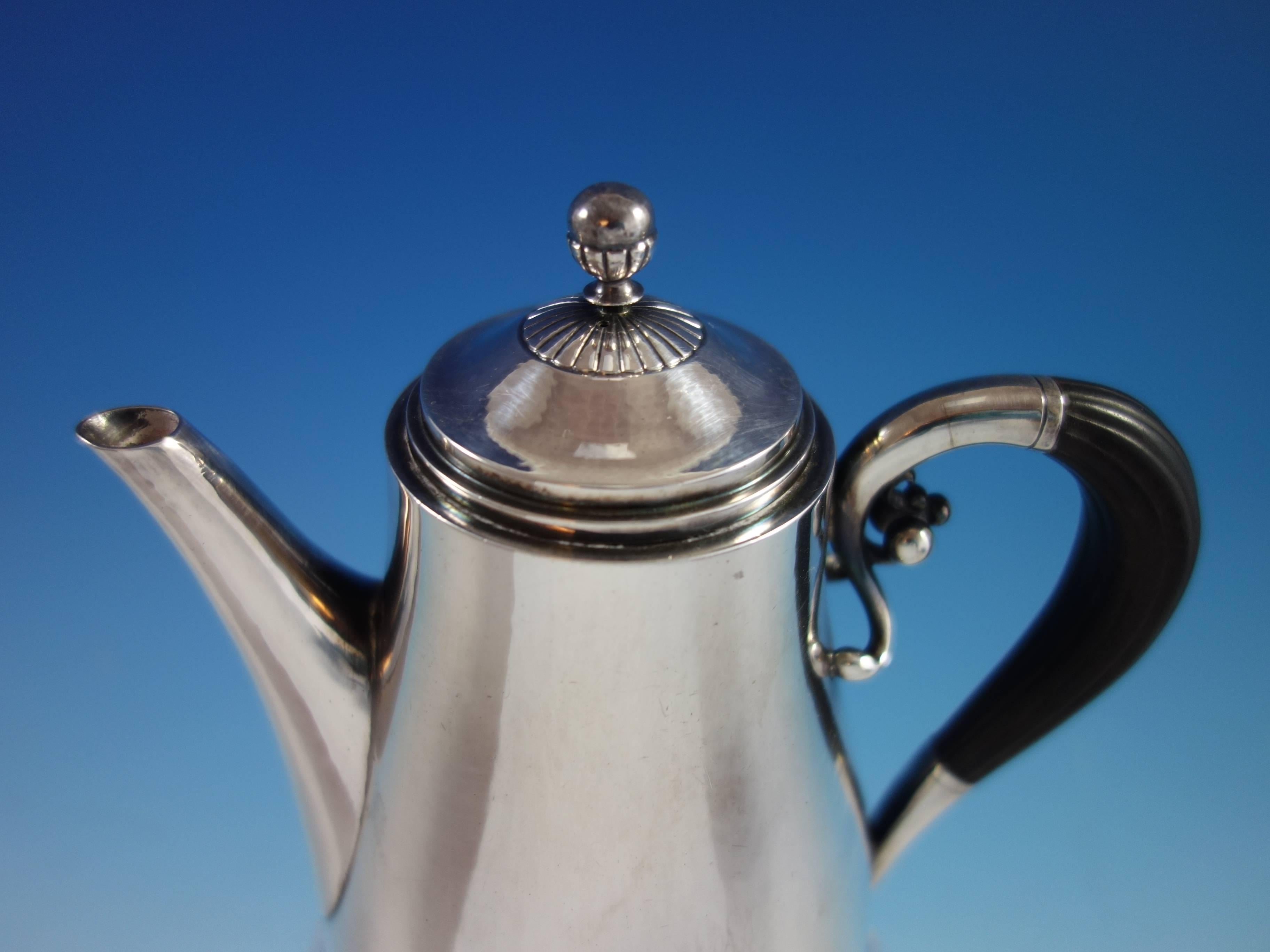 Stunning Cosmos by Georg Jensen small sterling silver coffee pot. It's marked with #45B and measures 7 1/2" high by 6" wide. It is not monogrammed and is in excellent condition. Gorgeous!

100% satisfaction guaranteed!



 
