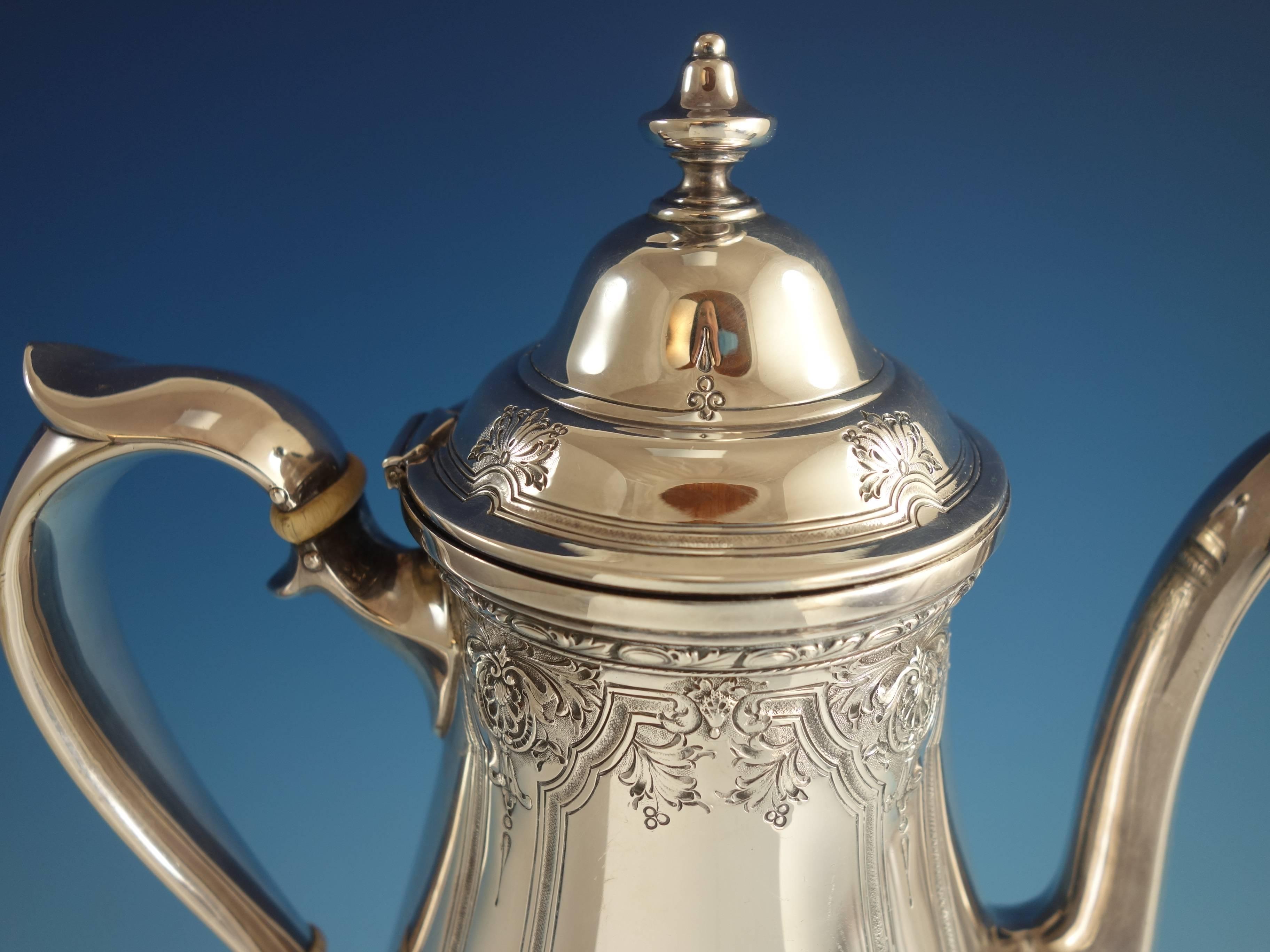 Navarre by Watson sterling silver coffee pot. It is beautifully chased. The piece has a scrolly monogram (see photos), and it's marked with #9826. The coffee pot measures 10