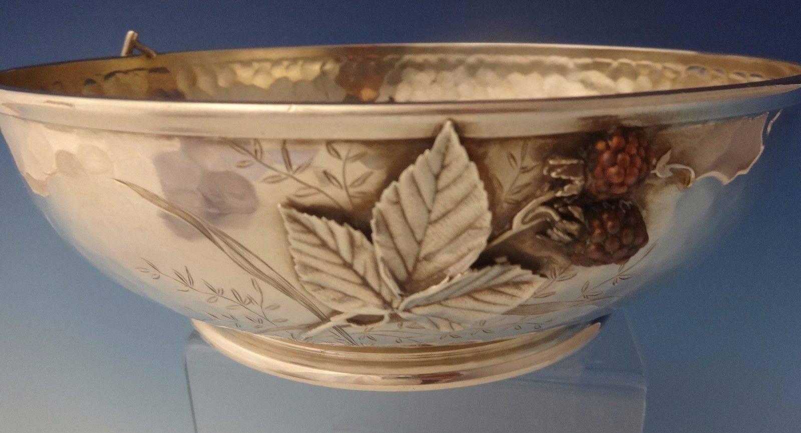 Mixed metals by Whiting.

 This amazing Whiting sterling bowl has applied mixed metal fruit. The bowl features applied sterling leaves and applied 3-D copper strawberries, cherries and raspberries. There are also bright cut leaves and grasses
