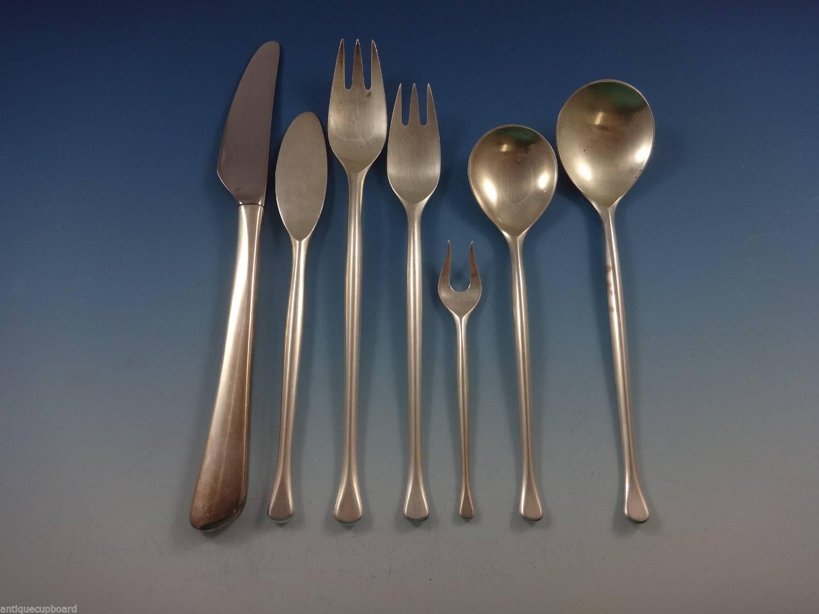 These magnificent, intricately handcrafted utensils show off the exceptional skill of the legendary Michelsen Copenhagen silversmiths. 

 
Rare saphir by A. Michelsen Danish-Moderne sterling flatware set of 60 pieces. This set includes:

Eight