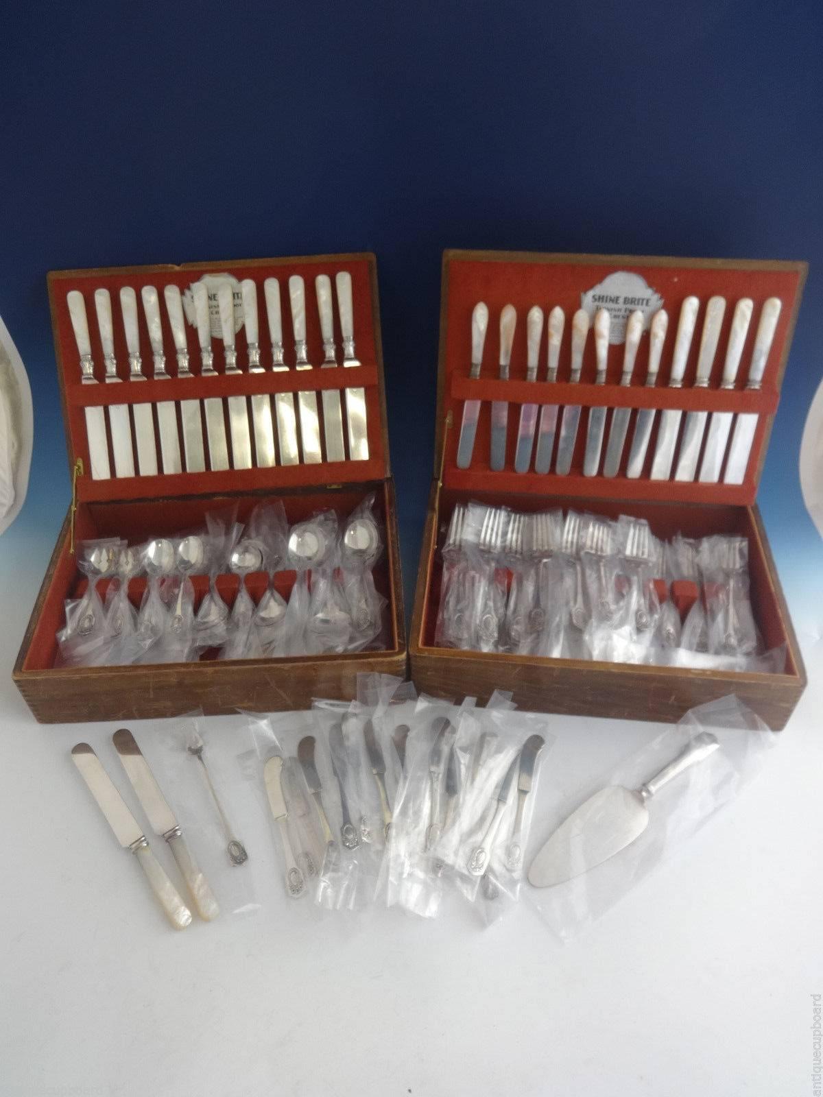Exceptional Louis XVI by Shreve sterling silver dinner size flatware set of 197 pieces.

This beautiful single owner monumental estate set comes to you in two vintage boxes. Lovely rare pattern with bow and wreath acid etched 
