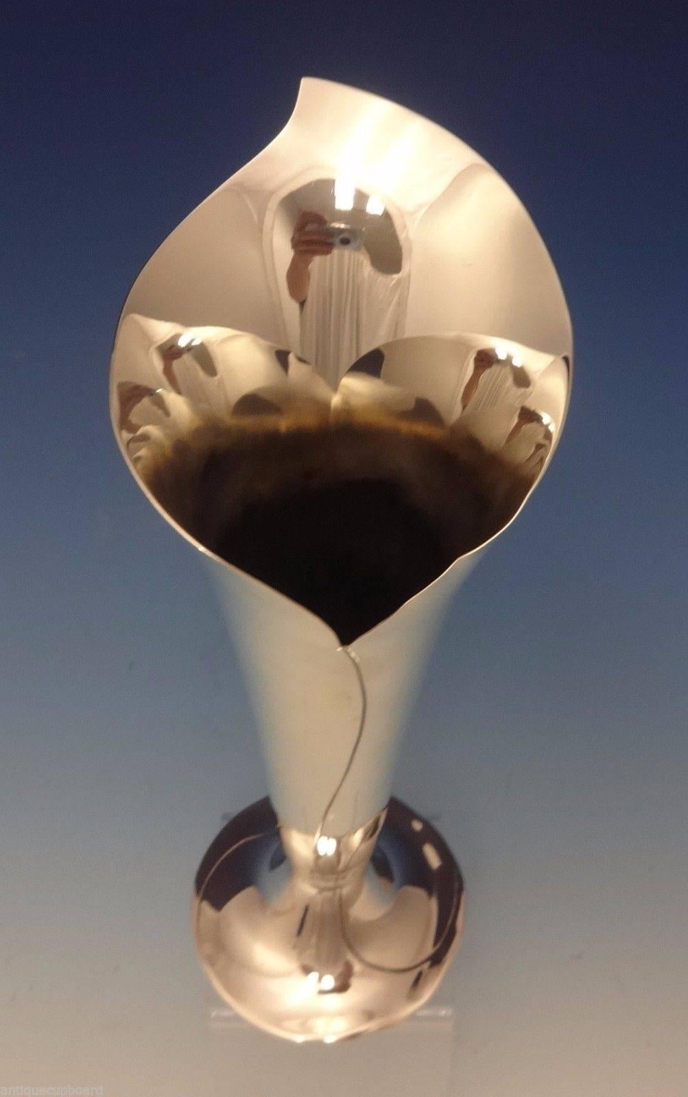 TIFFANY & CO.

Tiffany & Co. sterling silver modernist vase made by Tiffany & Co.  The vase has a beautiful calla lily or jack in the pulpit design.  It's marked with a 