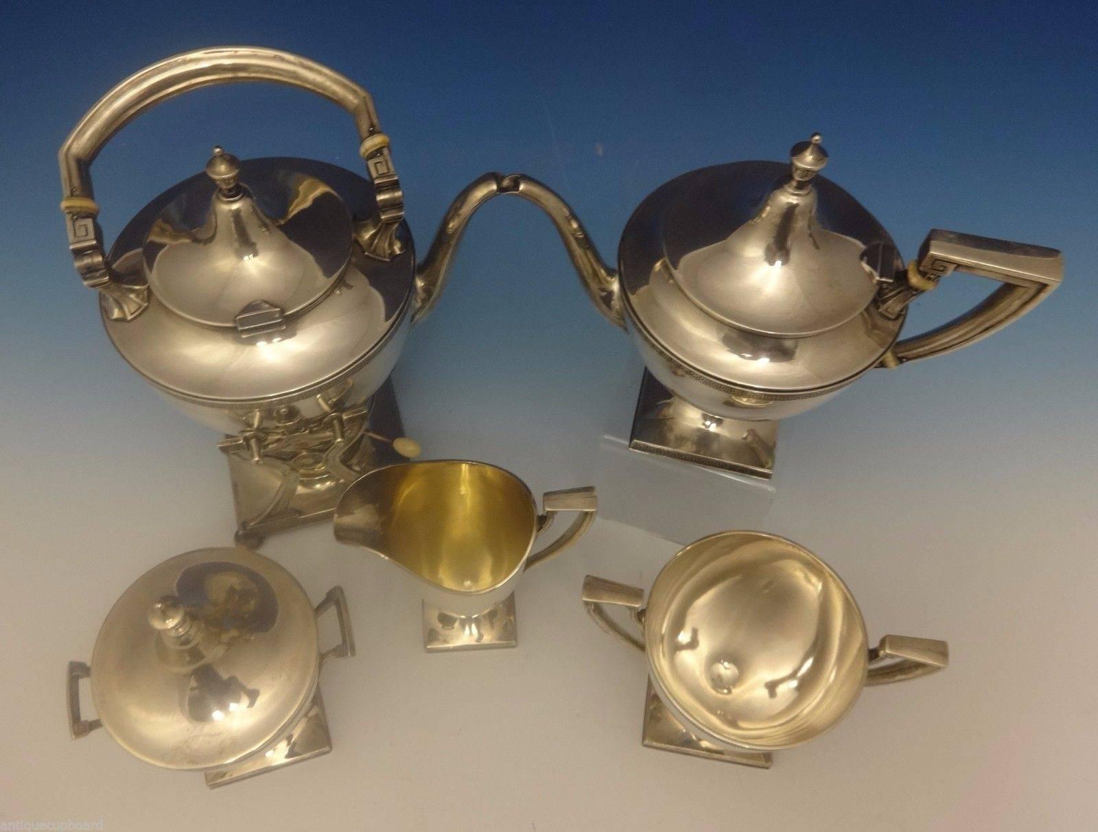 Etruscan by Gorham.

Art Deco Etruscan by Gorham five-piece sterling silver tea set. The set dates from about 1915 and has no monogram. It includes:

Kettle on Stand: Stamped with #9806 and it measures 12 1/2