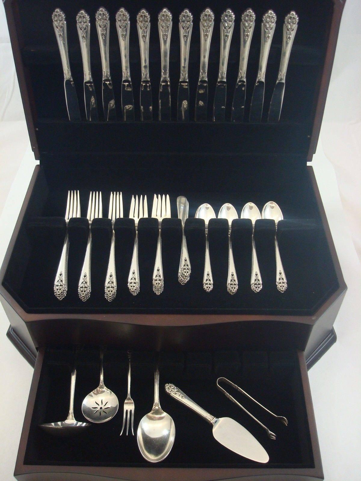 Queen's lace by International sterling silver flatware set, 67 pieces. This set includes:

12 knives, 9 1/8