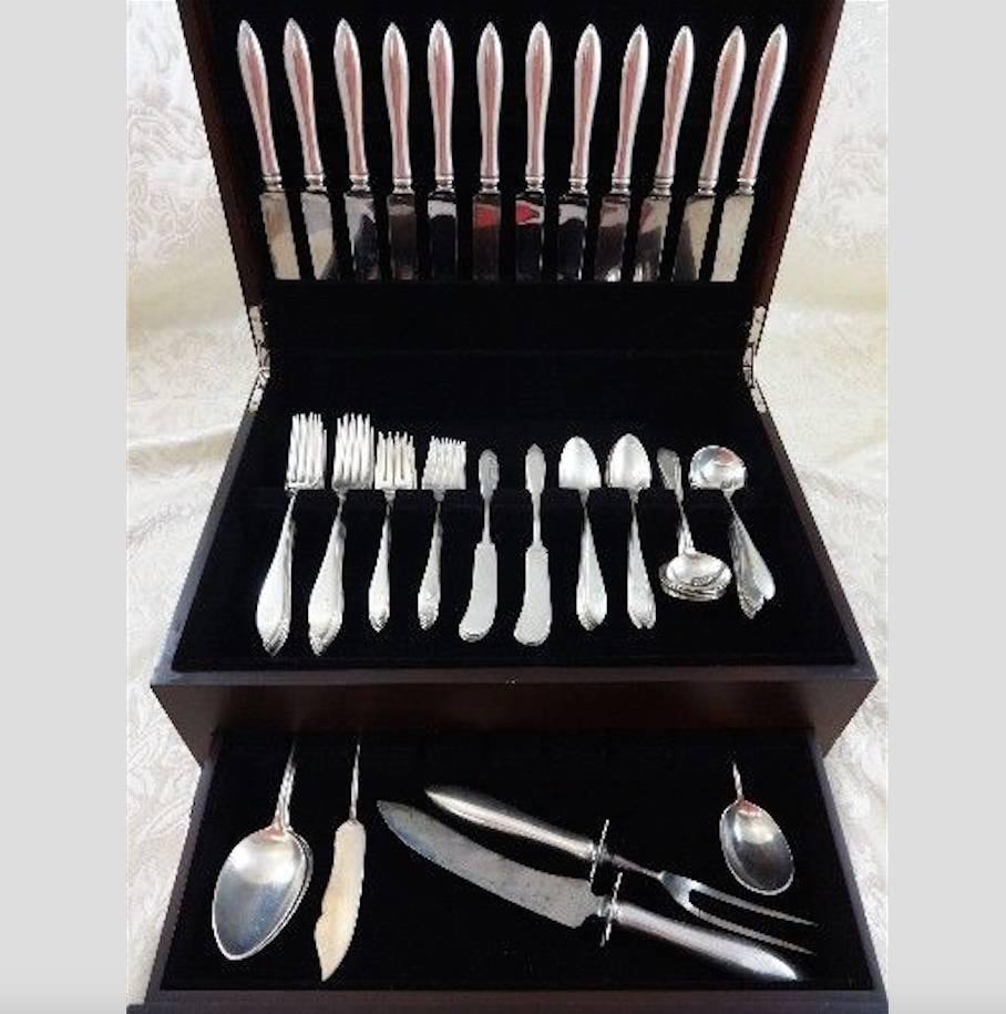 Mothers by Gorham sterling silver flatware set, introduced in the year 1875. The pointed design is simple and timeless. This 80 piece set includes:

12 knives, 8 1/2