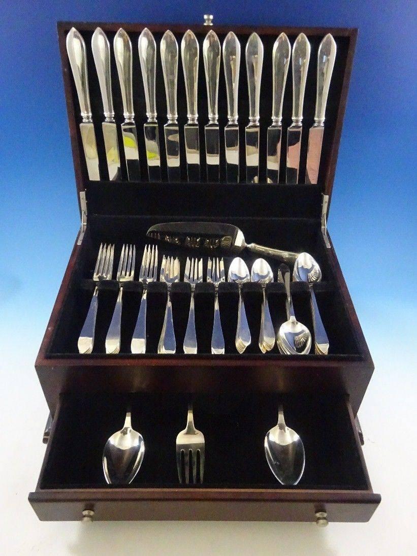 Faneuil by Tiffany and Co sterling silver flatware set, 64 pieces. This set includes: 

12 dinner size knives, 10 1/4