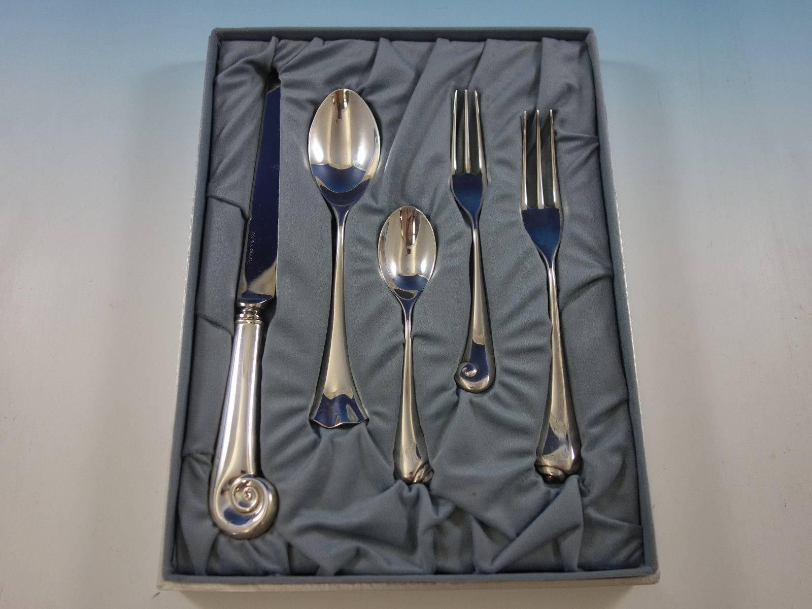 Unique Angela Cummings sterling silver dinner flatware set with fabulous modern shell motif, differing shells, 40 pieces. This set includes: Eight dinner size knives, 6 - 9 3/4