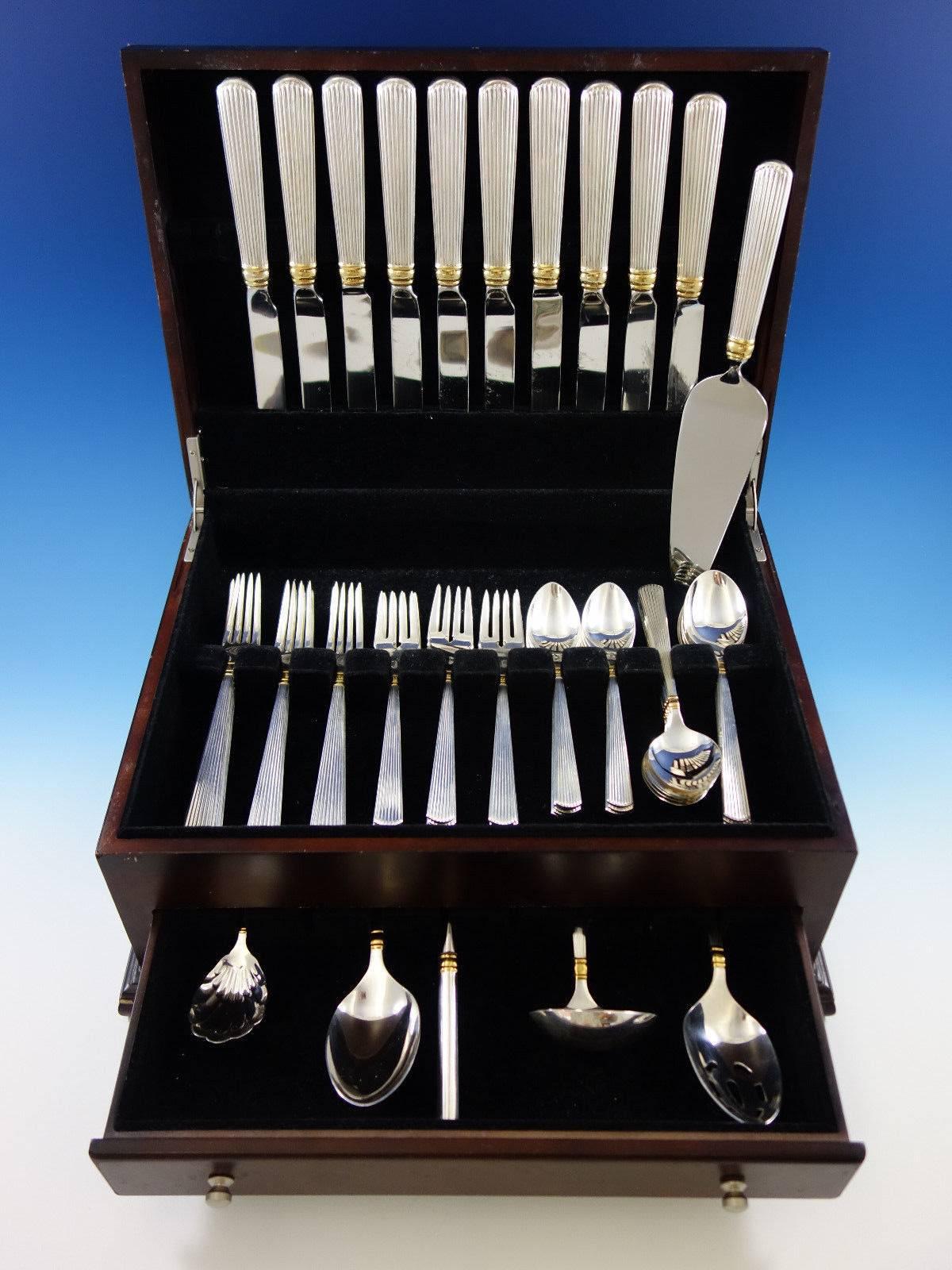 Dinner size golden ashmont (gold accent) by Reed & Barton sterling silver flatware set, 56 pieces. This set includes: 

Ten dinner size knives, knife blades vary slightly, 10
