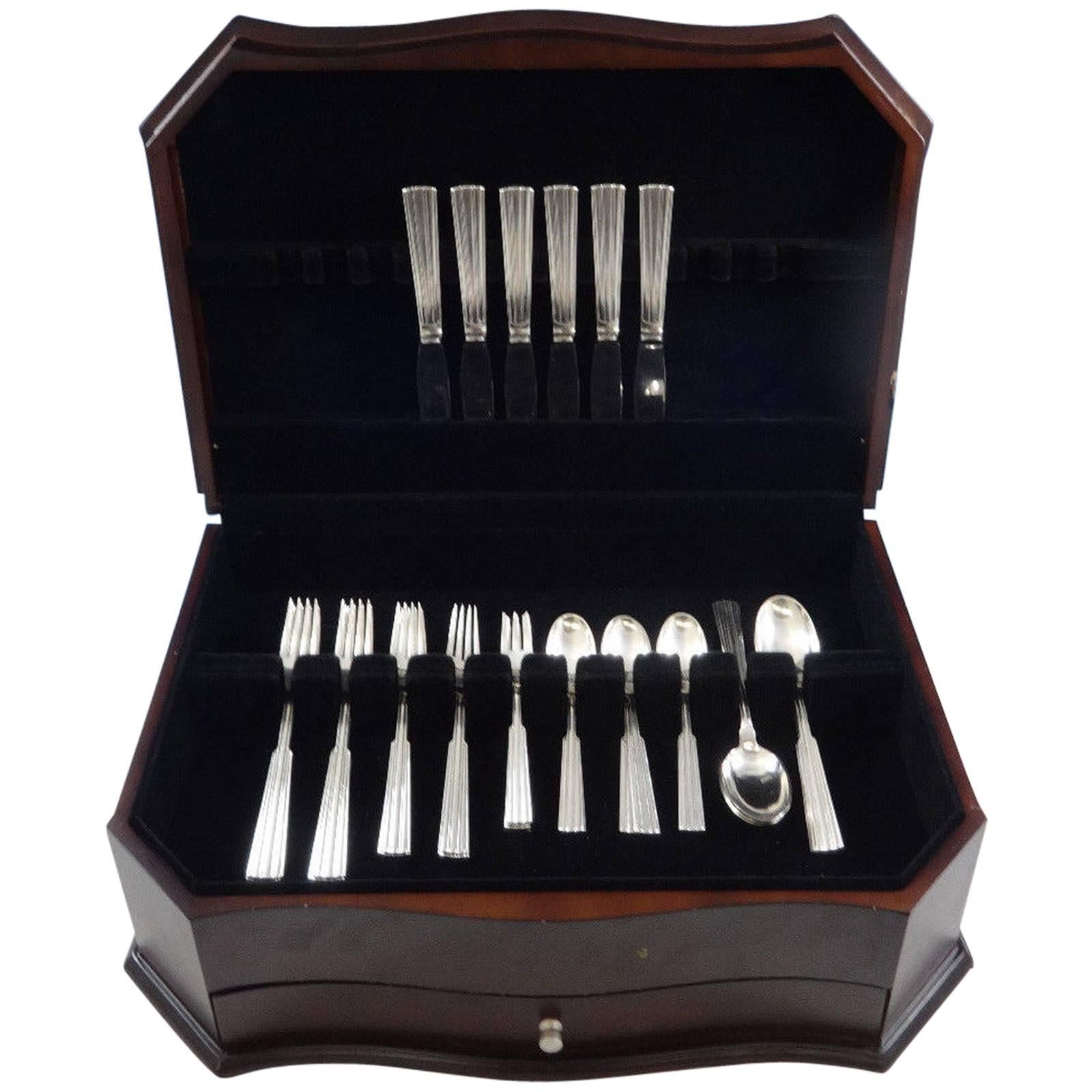 Else Marie by Orla Vagn Mogensen Danish sterling silver flatware set of 36 pieces.
 
Renowned silversmith Orla Vagn Mogensen was a silversmith in Denmark (Copenhagen) from 1949-1975. Orla Vagn Mogensen was also a top designer for Georg Jensen and