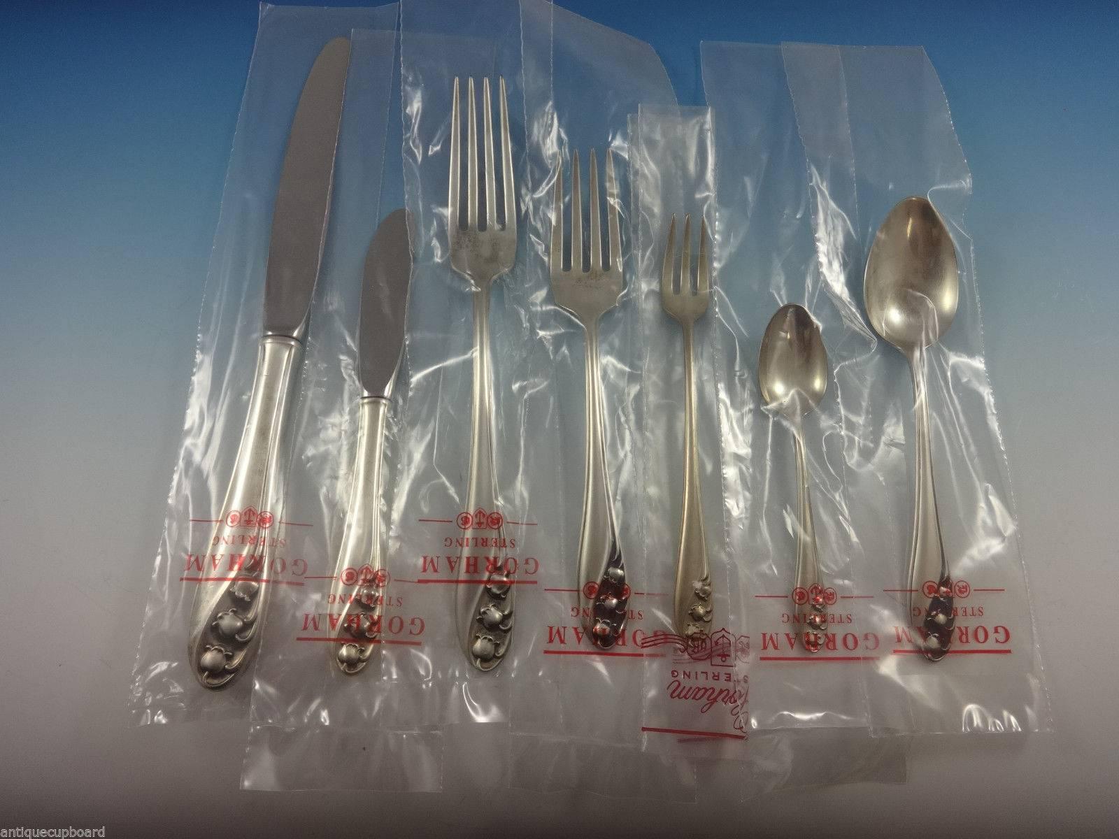 Dinner size lily of the valley by Gorham sterling silver flatware set of 62 pieces. This set appears unused, the pieces are still in the factory sleeves! This set includes: 

eight dinner size knives, 9 5/8