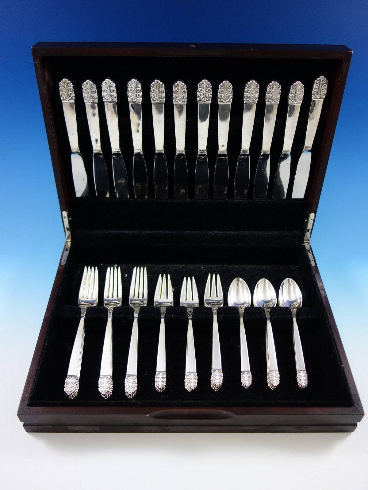 Mid-Century Modern northern lights by international glossy sterling silver flatware set, 48 pieces. This set includes: 

12 knives, 9