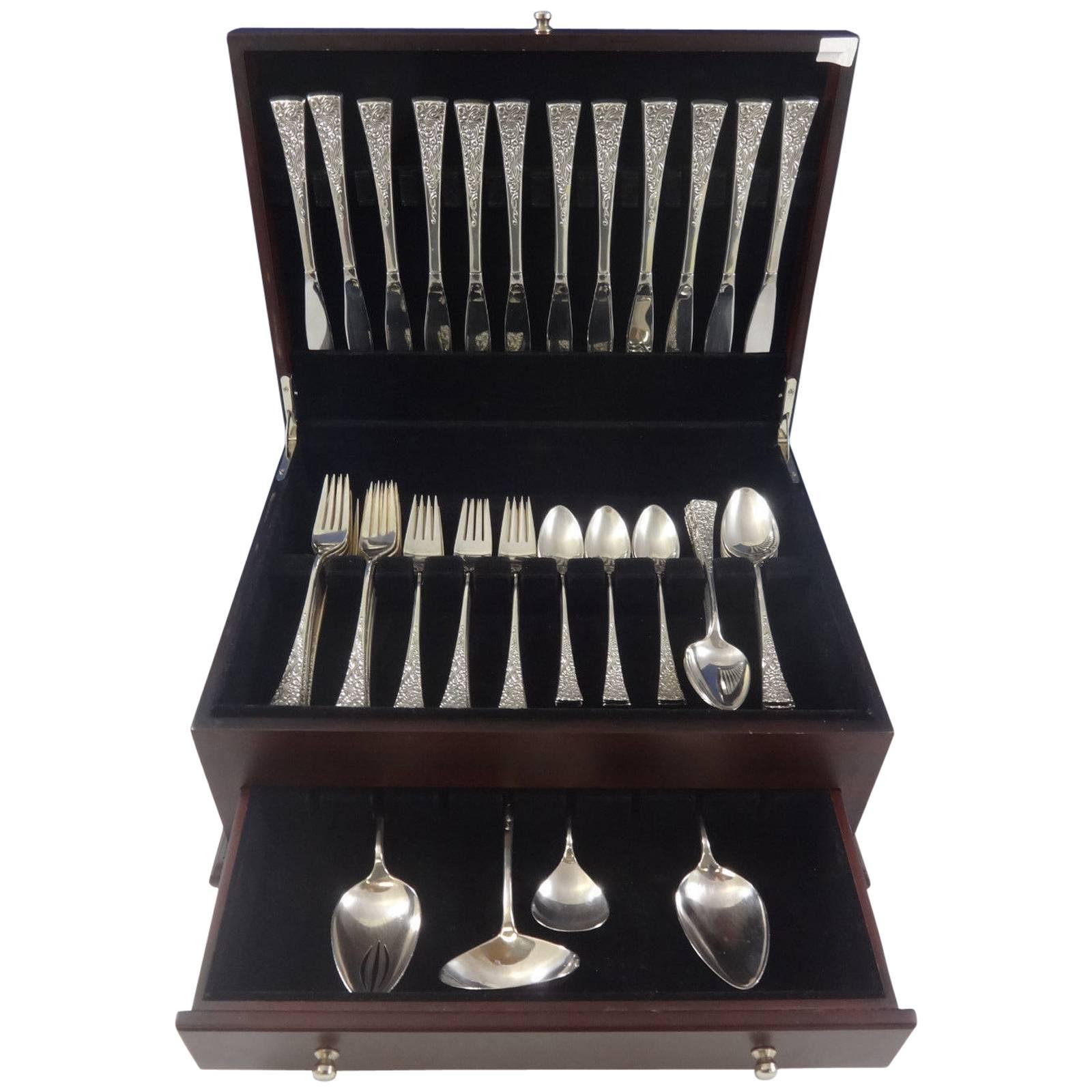 Mid-Century Modern 52 piece tapestry by Reed & Barton sterling silver flatware set, designed by famed metalsmith john prip. This set includes: 

12 knives, 9