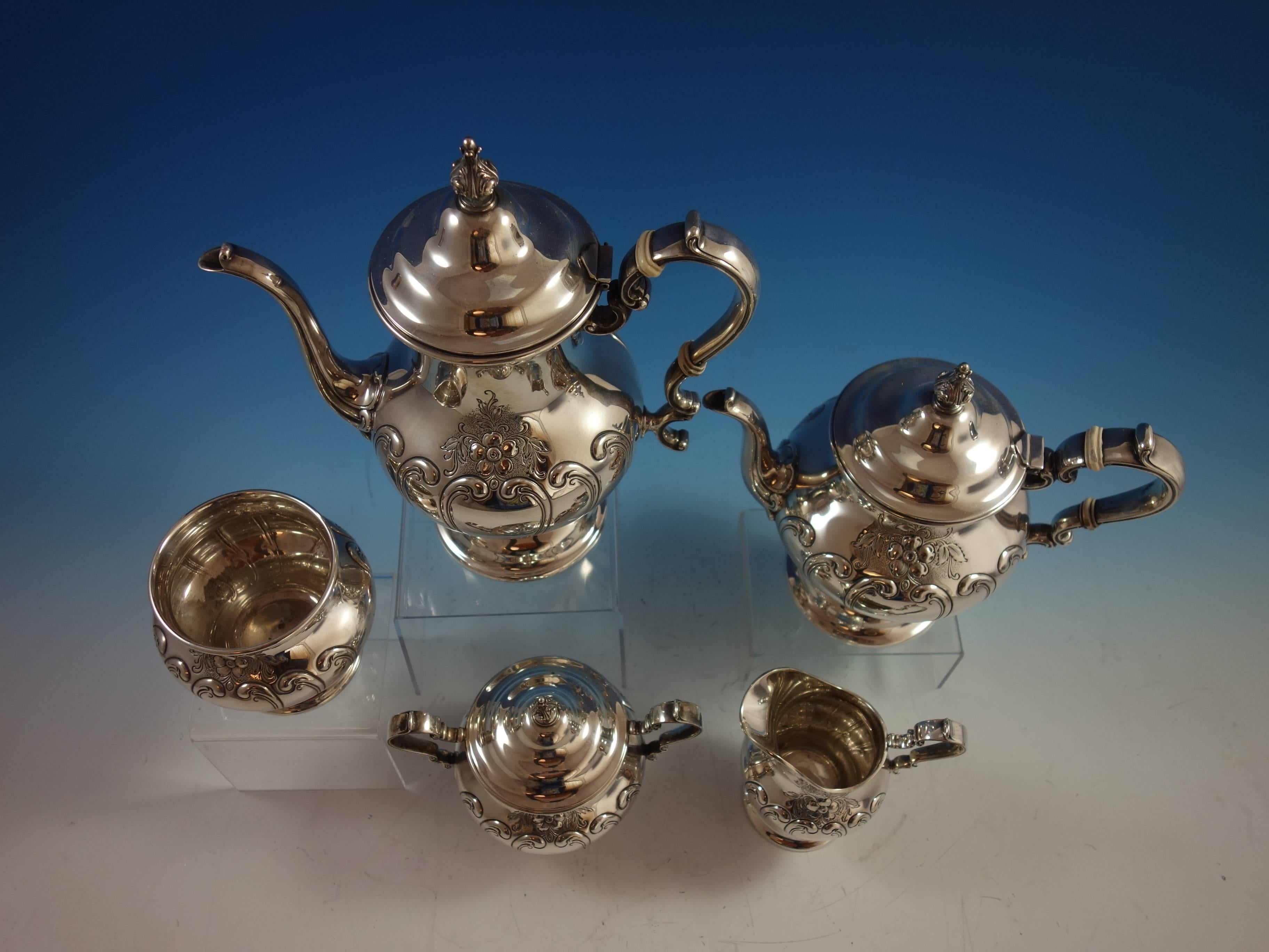 Chantilly Duchess by Gorham sterling silver hand chased tea set, five pieces. Date mark for 1957. This set includes: 

One coffee pot: Marked #1001-2, weighs 33.96 troy ounces, and measures 10