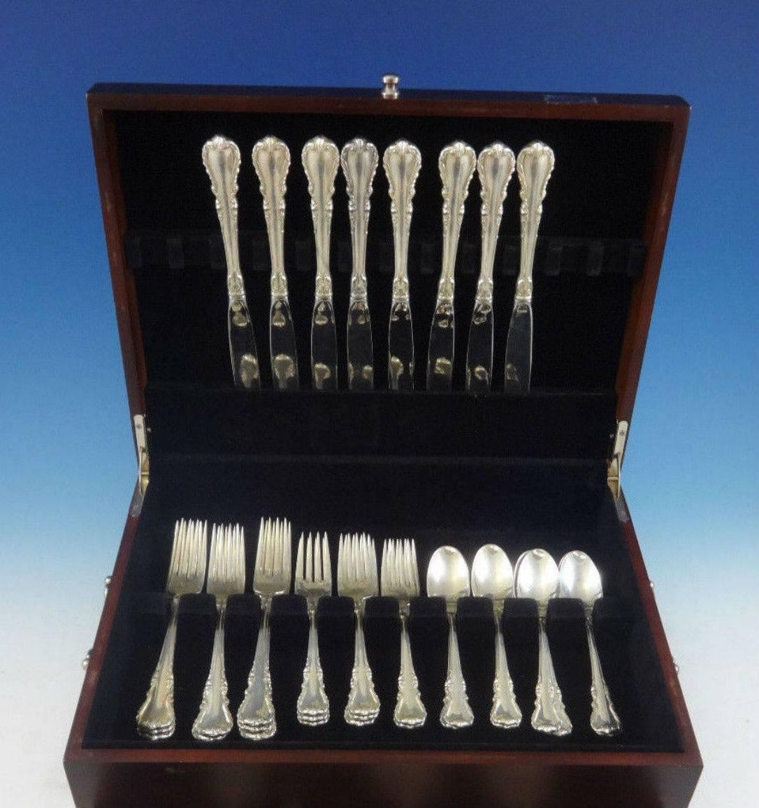 Melanie by Wallace sterling silver flatware set - 32 piece set. This set includes:

Measure: Eight dinner size knives, 9 1/2