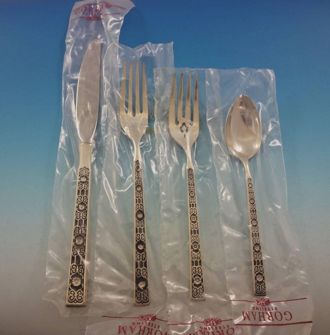 New, unused Spanish Tracery by Gorham sterling silver flatware set, 34 pieces. This set includes: 

Eight Place Knives, 9