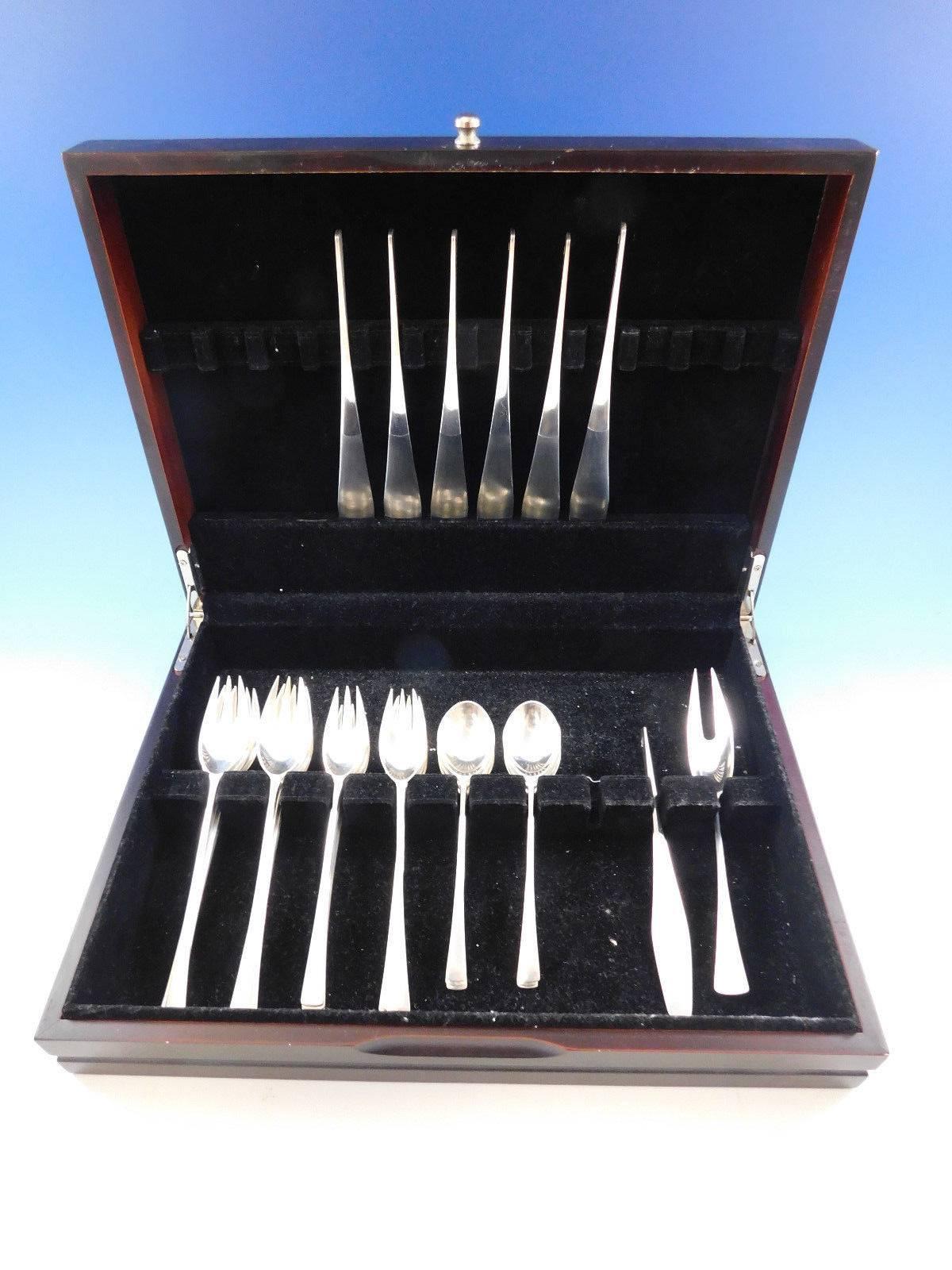 Fabulous Scandinavian Modern Tjorn by Dansk sterling silver flatware set of 26 pieces. This set has solid handle knives with innovative stainless blades that are nearly seamlessly where the blade meets the handle. 

This set includes: Six dinner