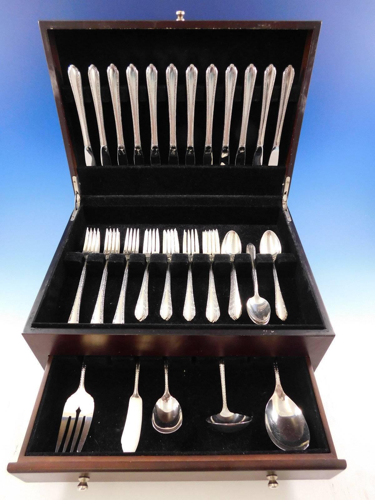 Grille size Wildflower by Royal Crest sterling silver flatware set, 53 pieces. This set includes: 

12 grille size knives, 8 3/8