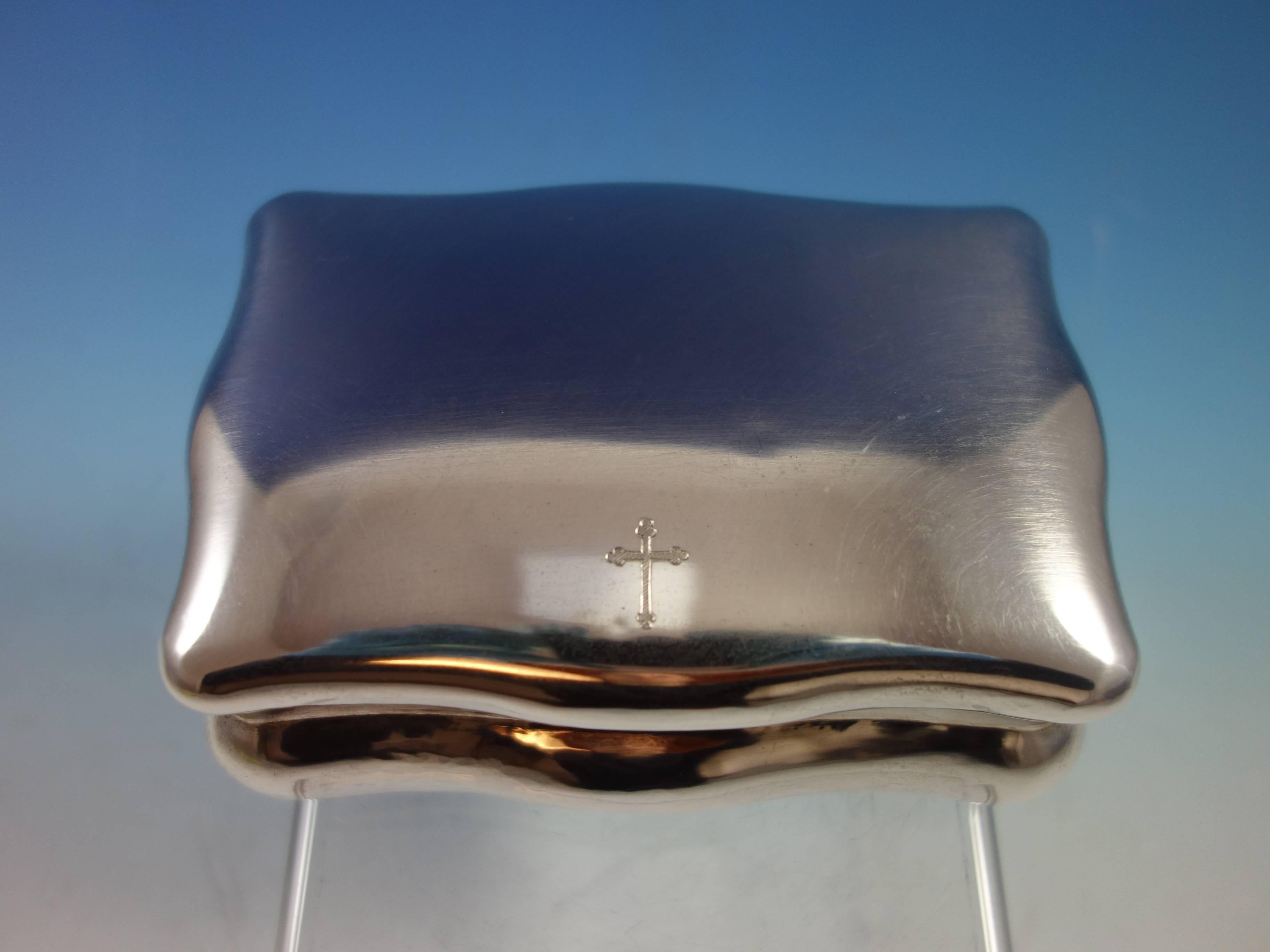 Fine Buccellati sterling silver jewelry box. The box has an etched cross on the top. It also has an inscription carved on the lip, inside edge of the cover that says, 