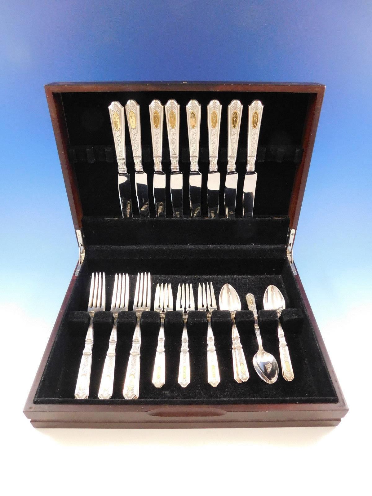 Dinner size Saint Dunstan Chased with Gold Accent by Gorham sterling silver flatware set - 32 pieces. This set includes: 

8 DINNER SIZE KNIVES, 9 5/8