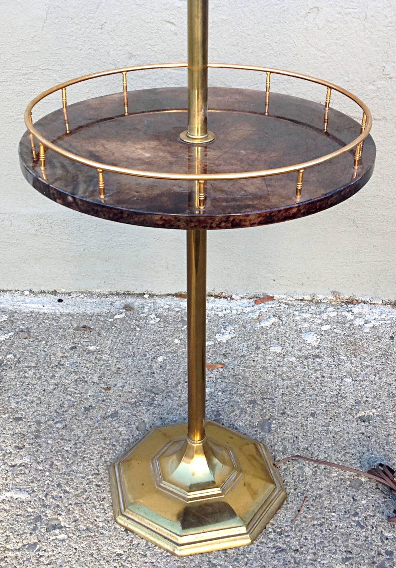 Brass floor lamp with parchment table at 21