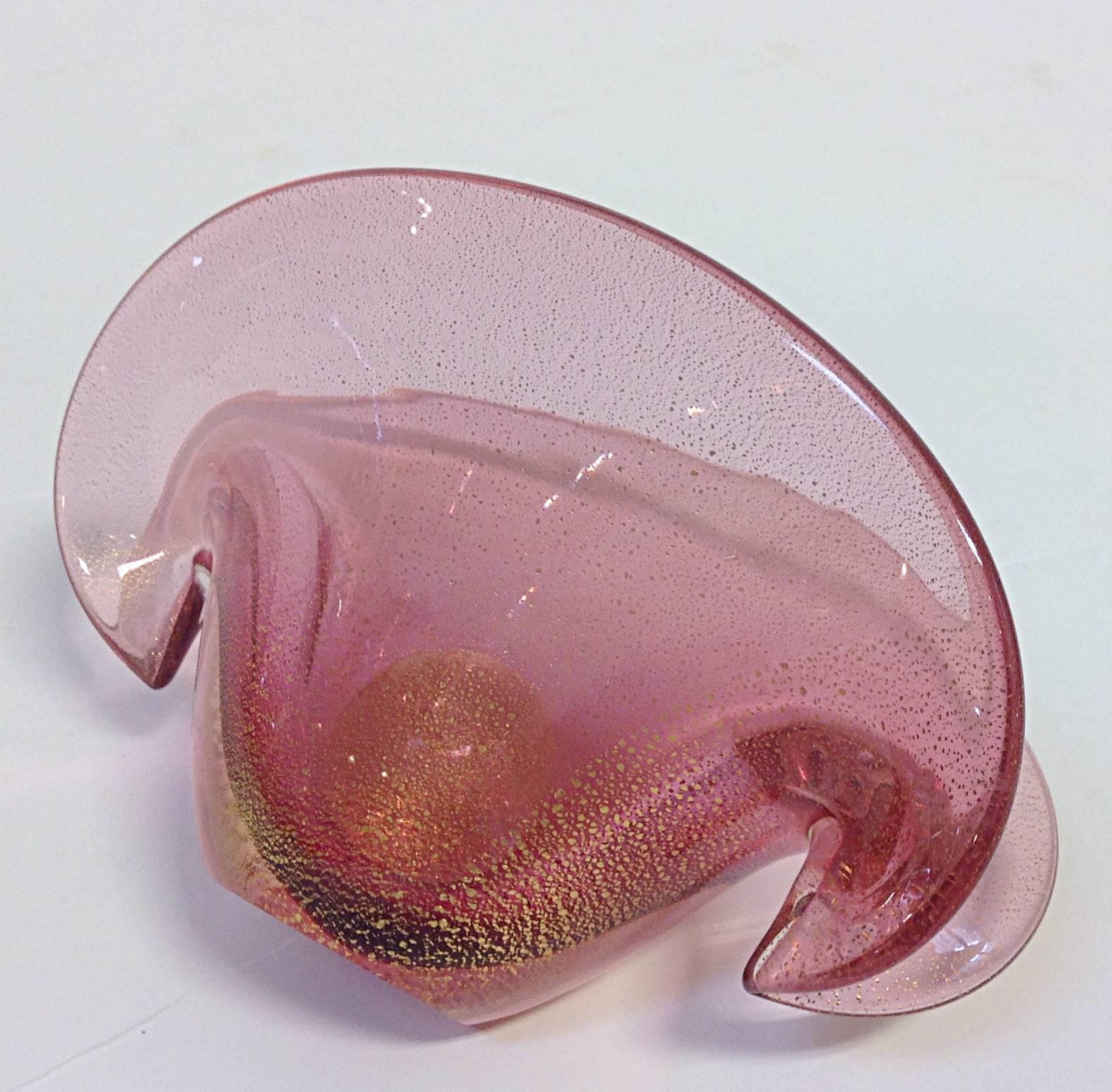 Exquisite Murano blown glass table decoration in the form of open mollusk with pearl. Shell is in pink glass with gold flecks and pearl is clear glass with gold flecks. Can be displayed either vertical or on its side. Graceful curves and even