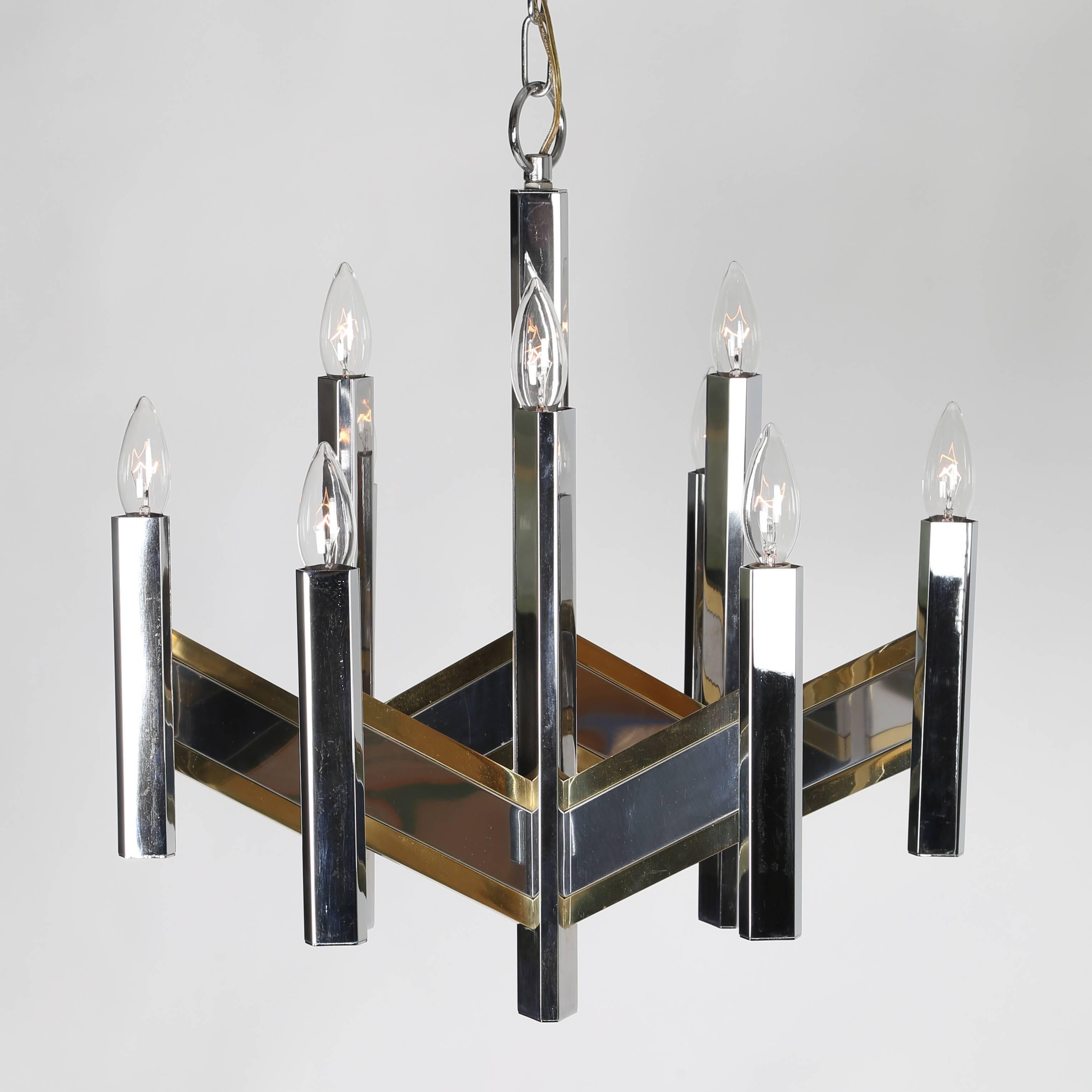 Lovely 1960s Sciolari for Lightolier chandelier with a zig-zag chevron pattern in mixed metals. Nine sockets hold candelabra-base bulbs. Original chrome chain and ceiling canopy. Fixture 20