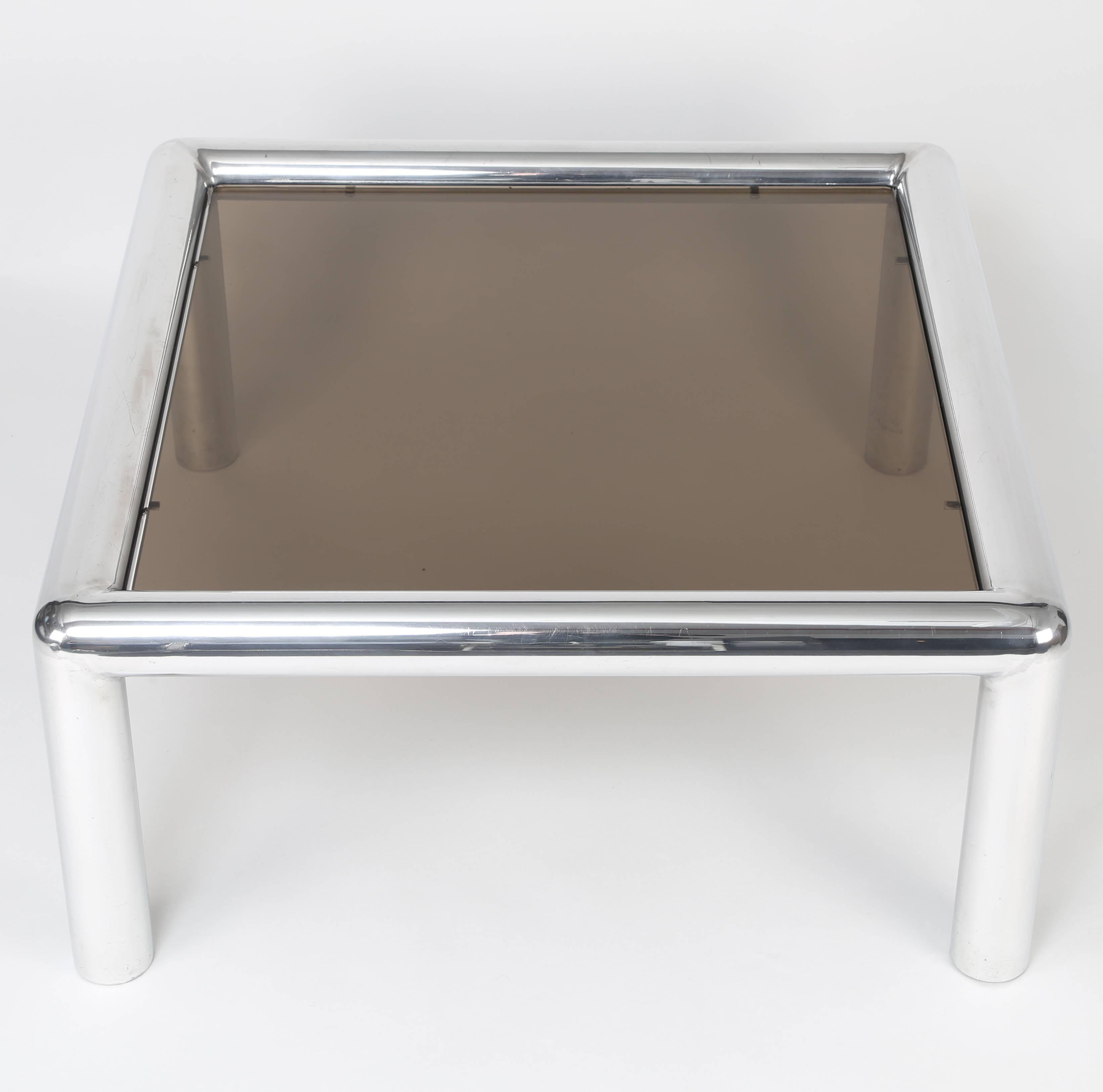 Polished tubular-aluminium and smoked-glass coffee table by New York designer John Mascheroni, circa 1960s. This table is in the permanent collection at MOMA. 3/8