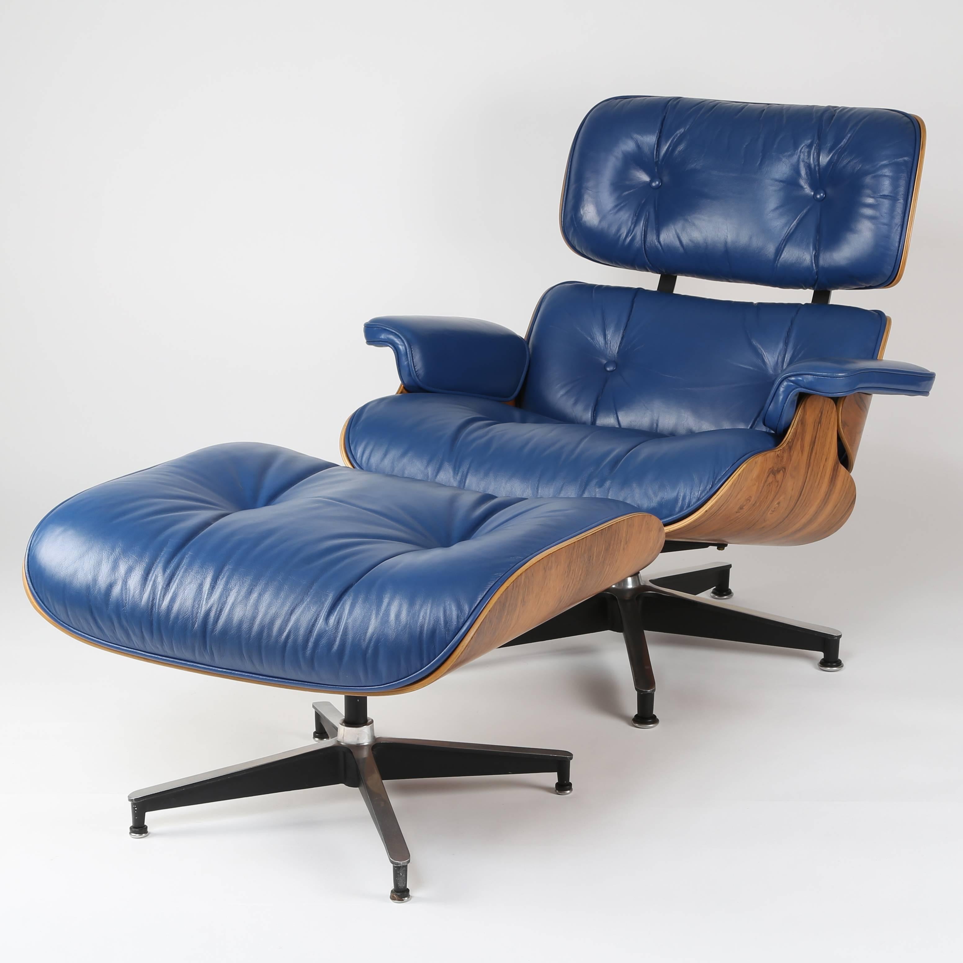 Rare royal-blue leather puts a unique twist on this iconic mid-century design. Restored and in excellent vintage condition, with smooth swivel mechanism. Purchased from the original owner, this set dates to the early 1970s. Original Herman Miller