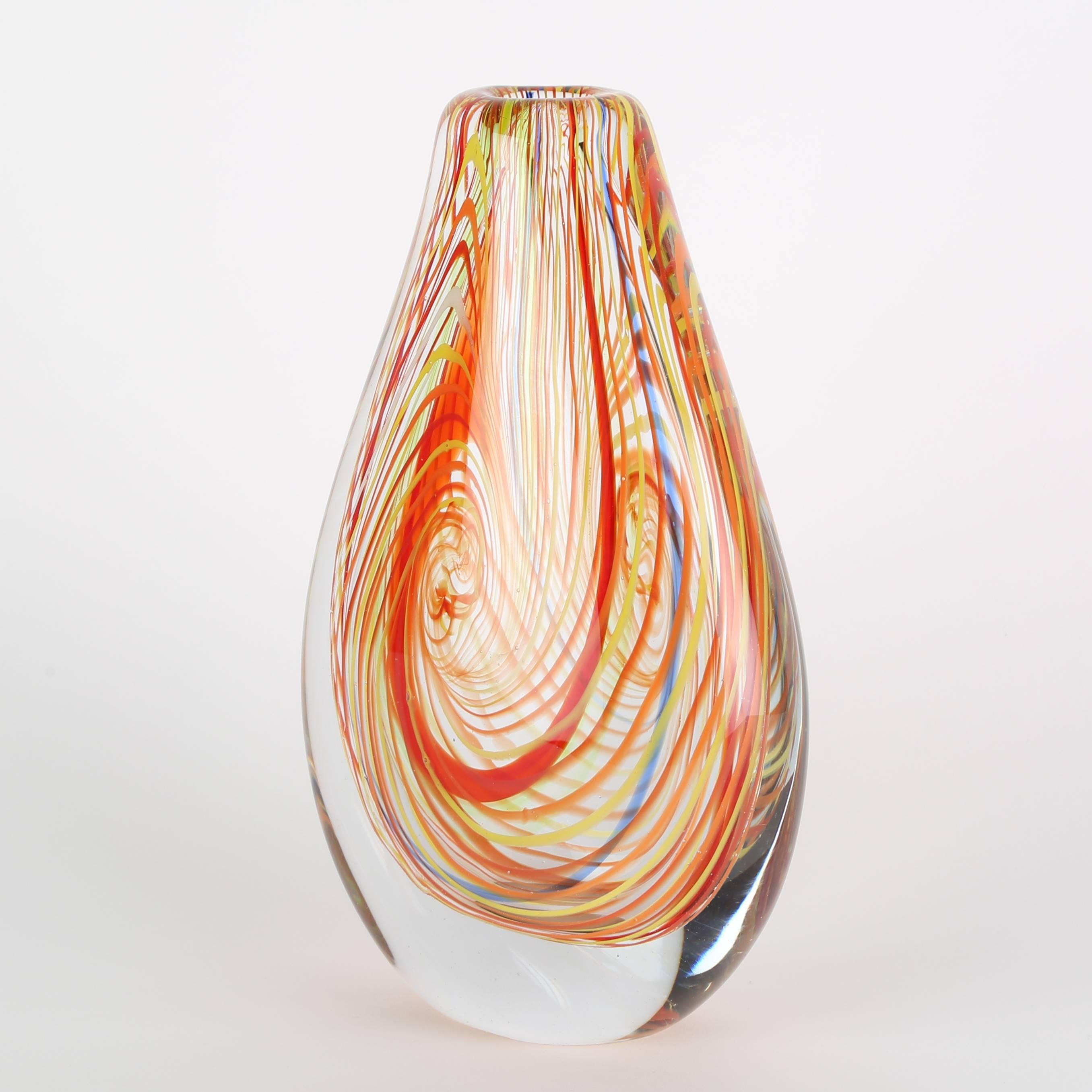 Large and beautifully crafted Murano glass vase featuring swirls of orange, red, yellow and blue set in clear glass.  This item is at the 1stdibs Gallery at the New York Design Center, 200 Lexington Ave., 10th floor, New York, NY.
