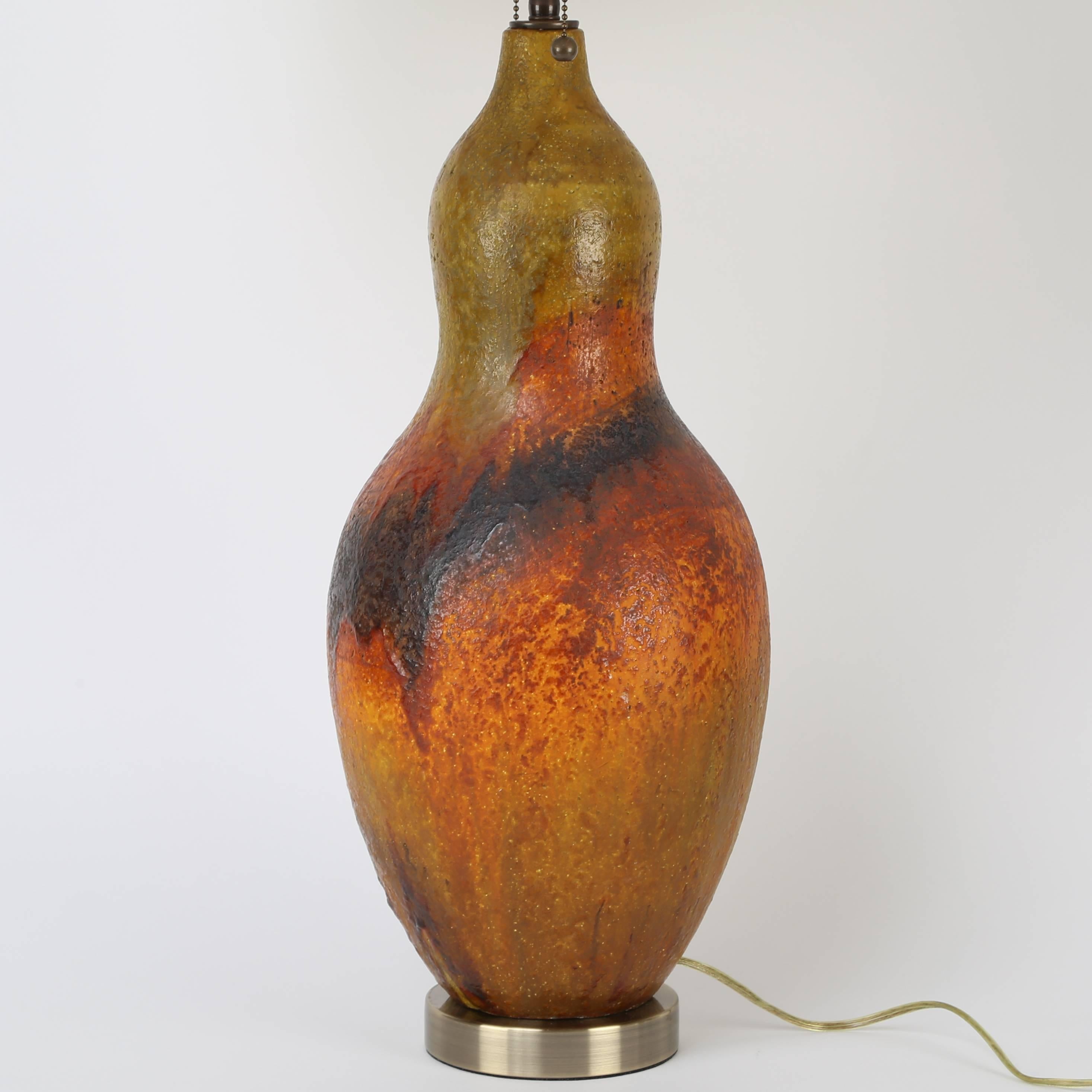 Substantial Fantoni for Raymor ceramic table lamp glazed in rich hues of green, orange, red and brown. The bulbous body is 9
