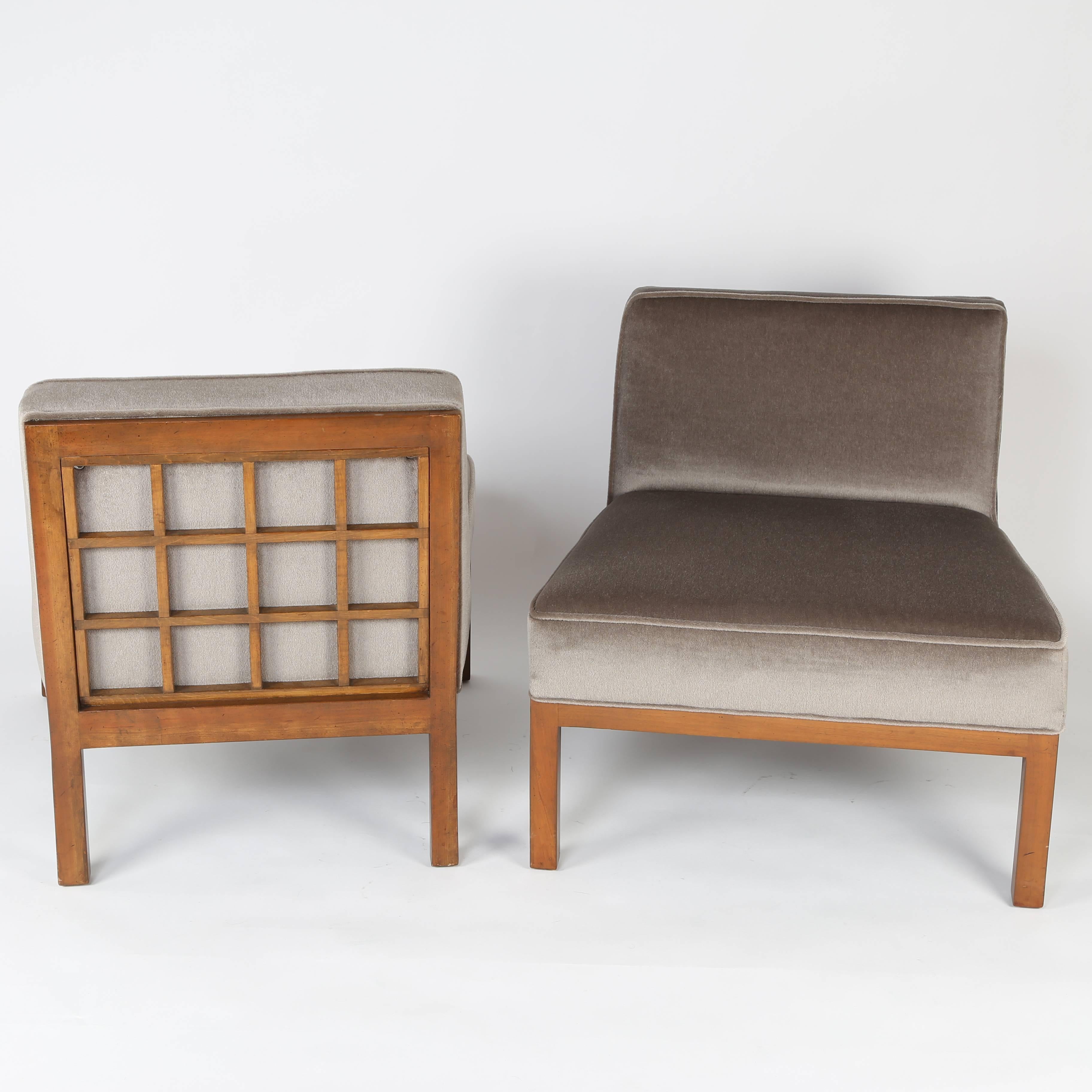 Chic pair of 1960s slipper chairs whose clean, modern lines contrast nicely with the wooden frames on the backs of each seat. From the Far East collection for Baker. New warm-brown mohair upholstery over new foam. These chairs are in our Brooklyn