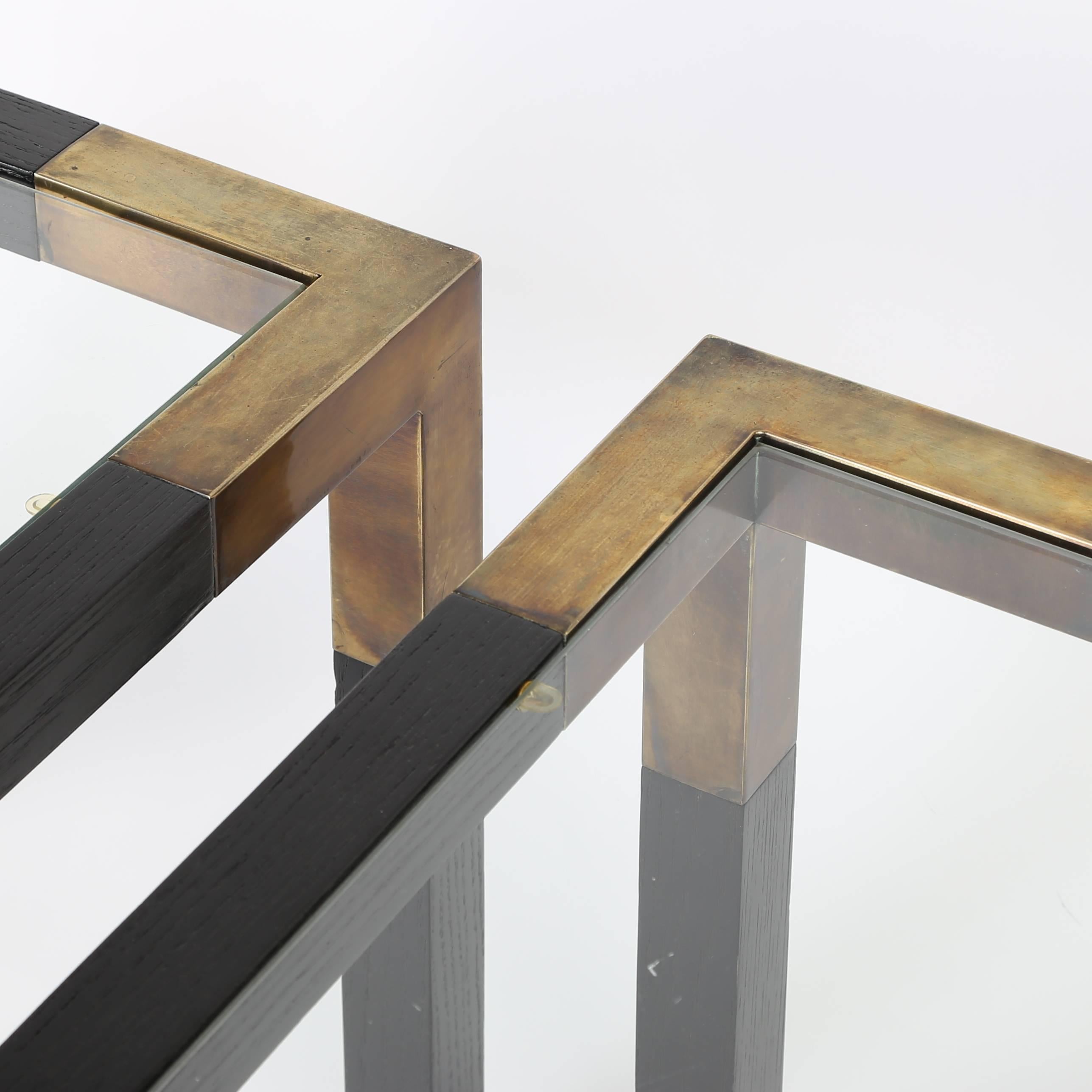 These matching end tables feature squared Parsons-style frames made of ebonized ash with solid-brass corners and feet. Inset glass tops. 

See this item in our Brooklyn showroom, 61 Greenpoint Ave., Suite 312, Brooklyn, 11 a.m. to 5 p.m. Tuesday