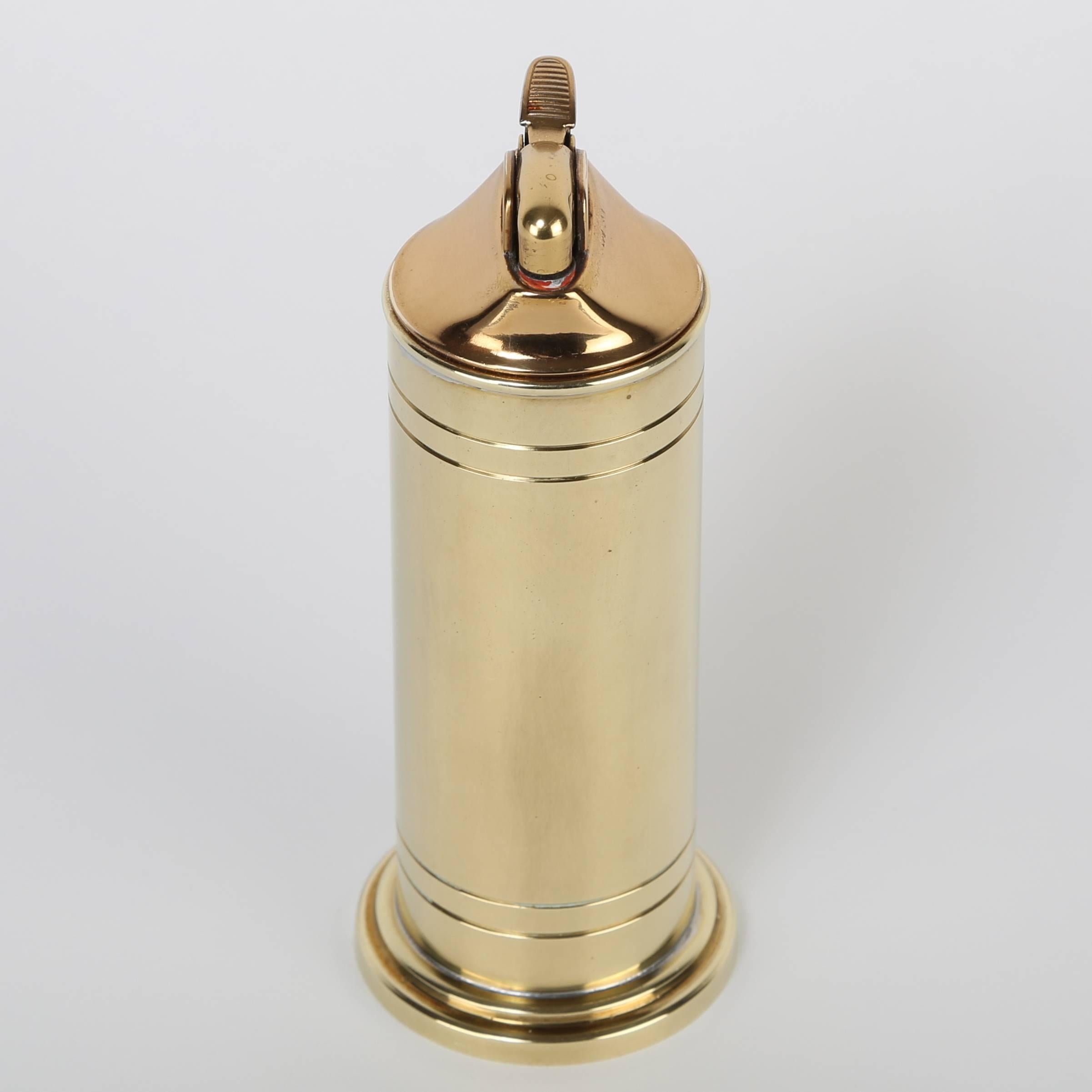 Fully functional brass table lighter designed by Tommi Parzinger, with quality execution in solid brass by Dorlyn Silversmiths. Stamped 