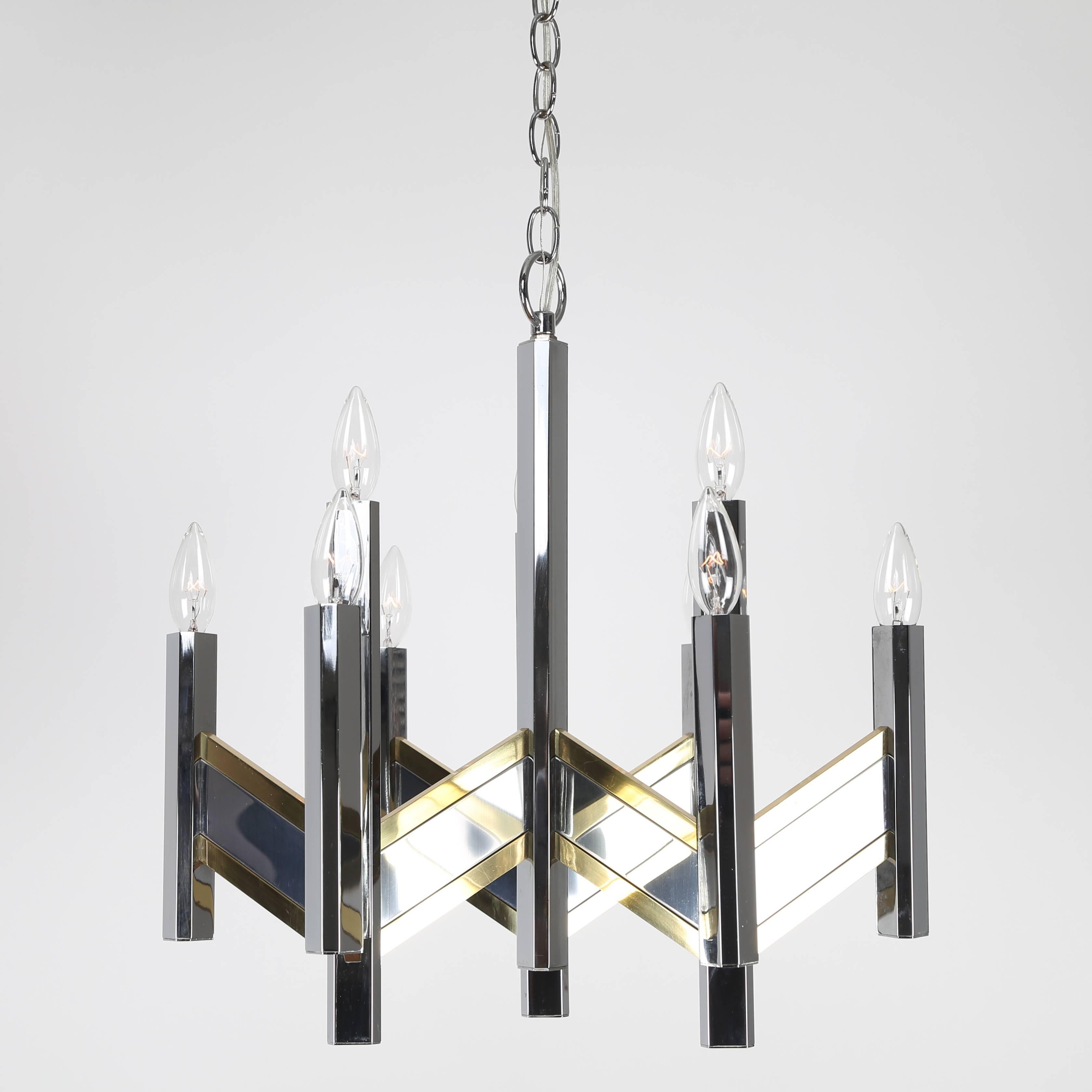 Lovely, 1960s Sciolari for lightolier chandelier with a zig-zag chevron pattern in mixed metals. Nine sockets hold candelabra-base bulbs. Fixture 20